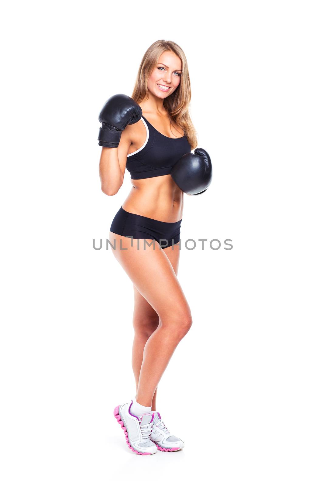 Young athletic woman in boxing gloves on a white background