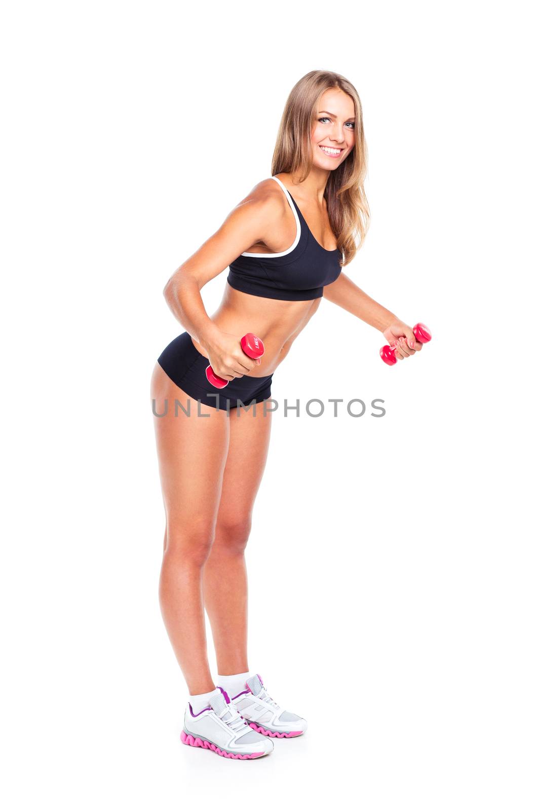 Beautiful slim woman with dumbbells, isolated on white background