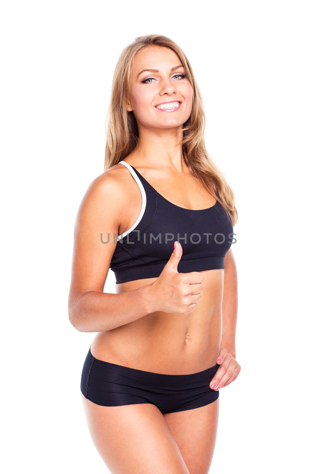 Young athletic girl with a finger up on white background