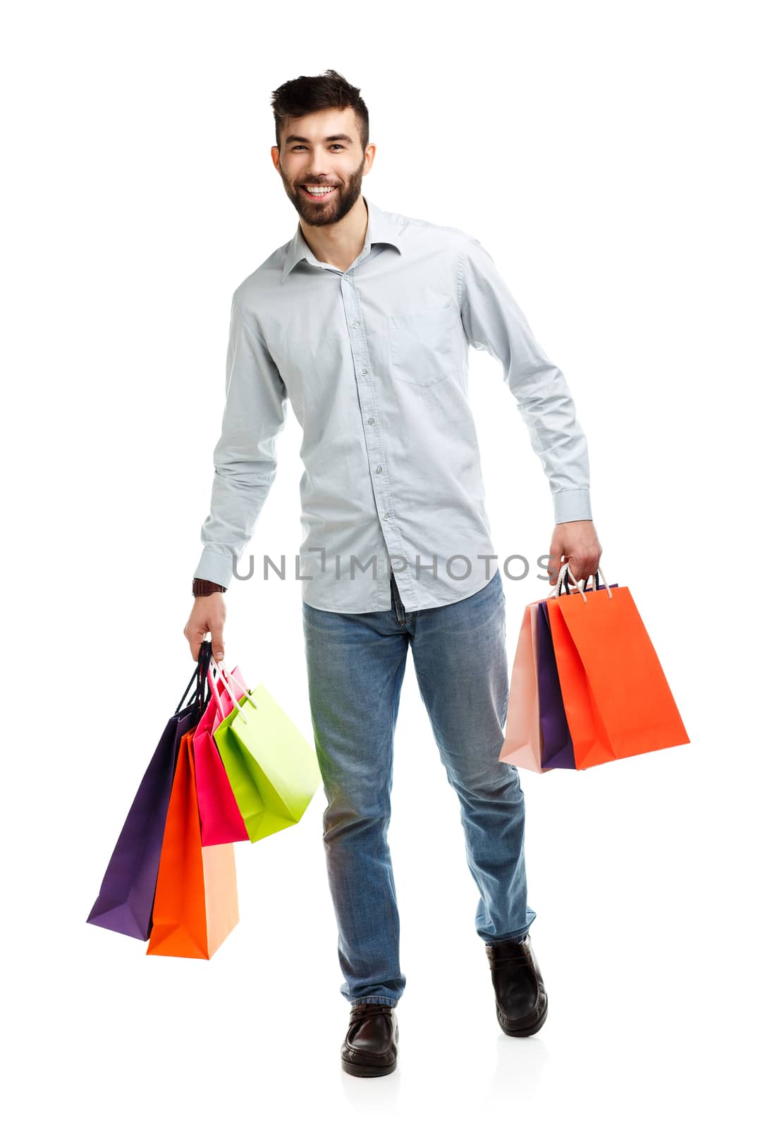 Handsome man holding shopping bags by vlad_star