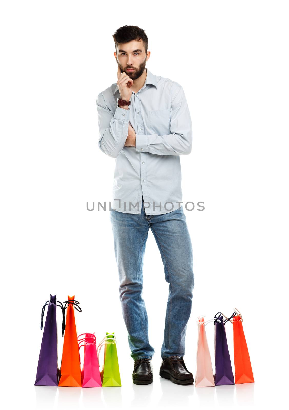 Handsome man with shopping bags. Christmas and holidays concept