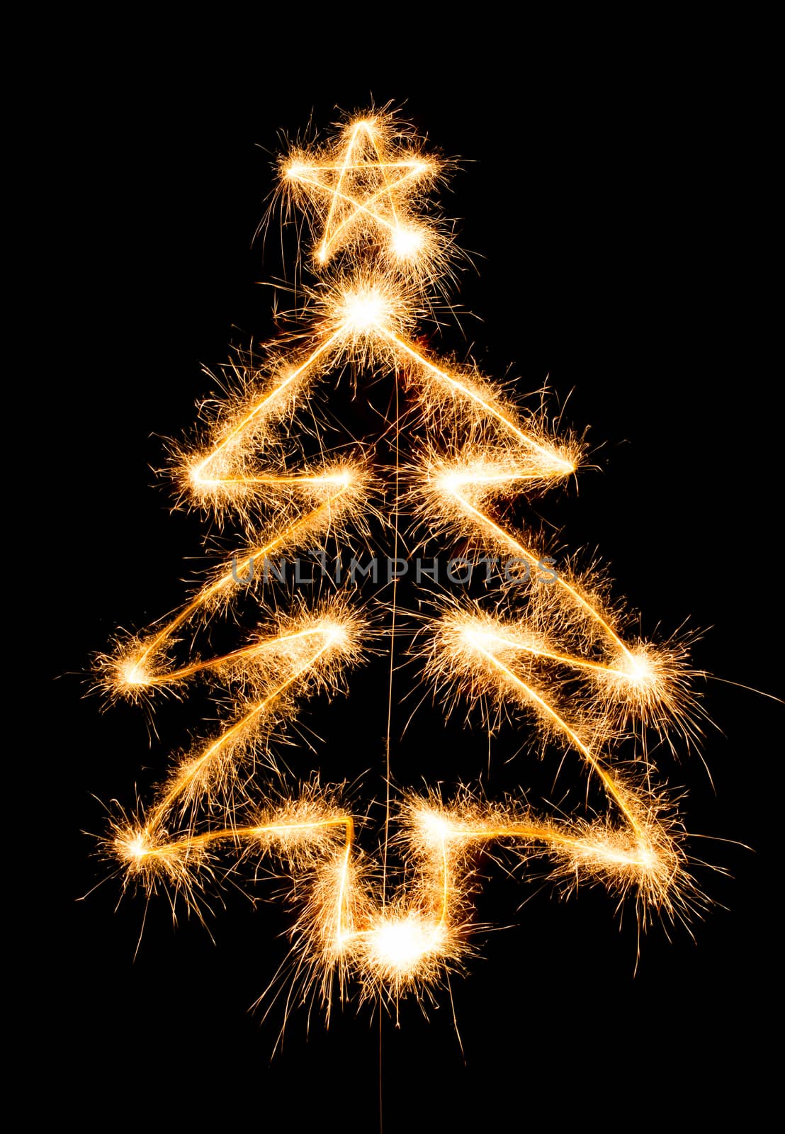 Christmas tree made by sparkler on a black background