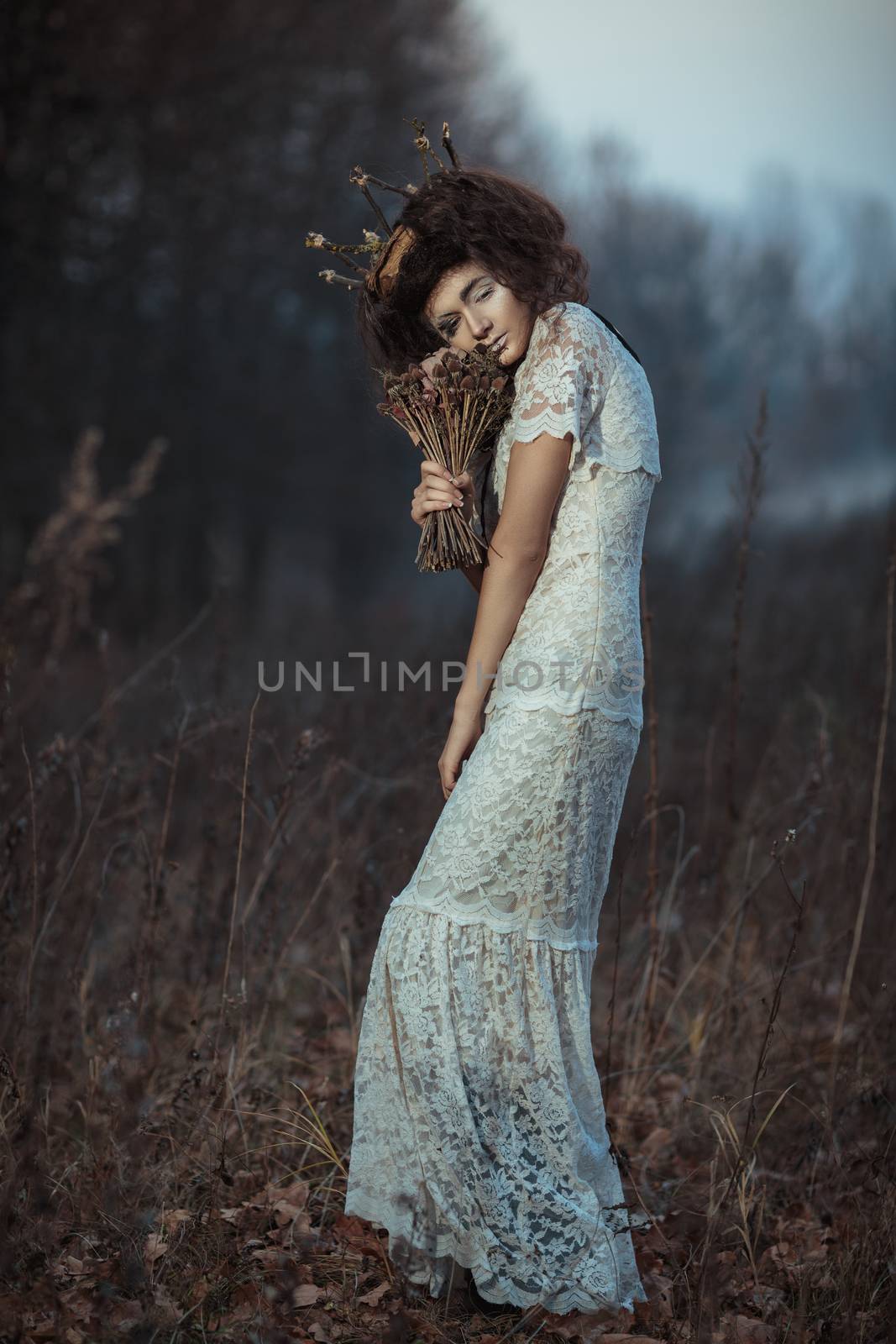 Young girl in a white lace dress, a crown of twigs with a bouque by vlad_star