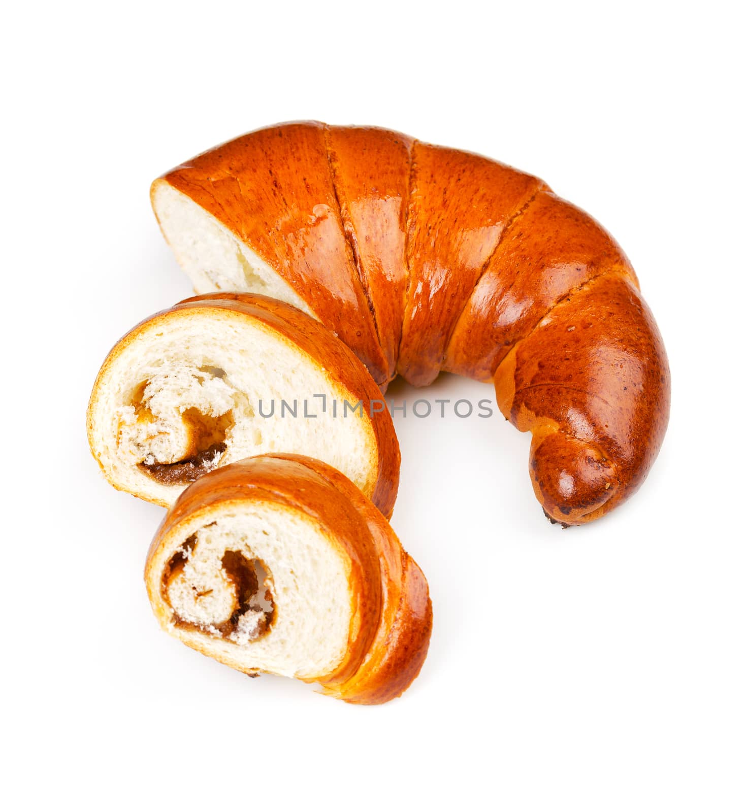 Fresh and tasty bagel with jam sliced pieces over white background