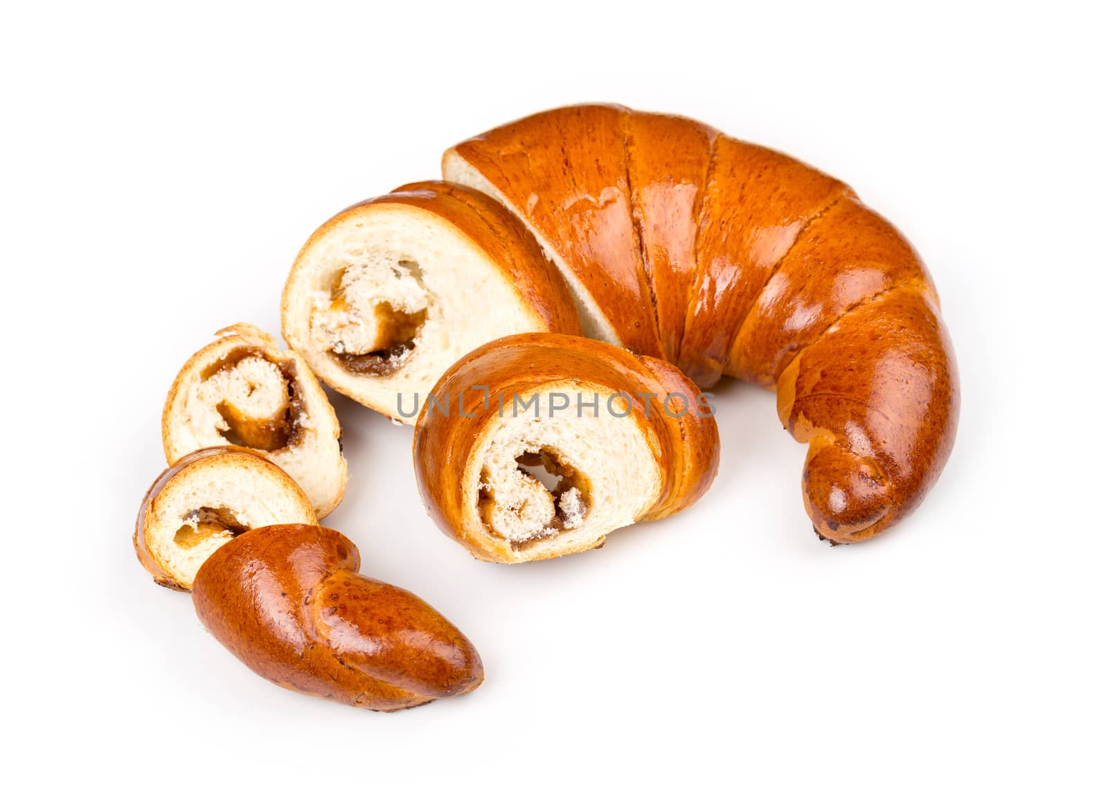 Fresh and tasty bagel with jam sliced pieces over white background