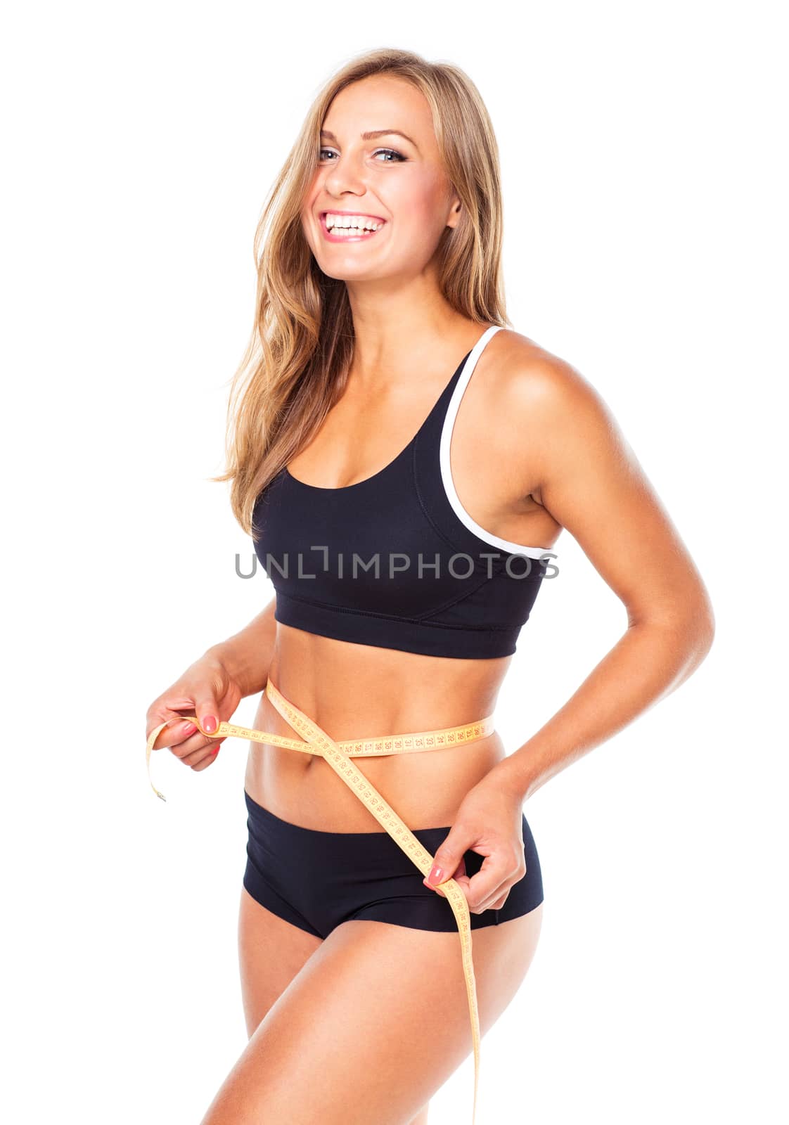 Portrait of attractive caucasian smiling woman with measuring tape isolated on white background