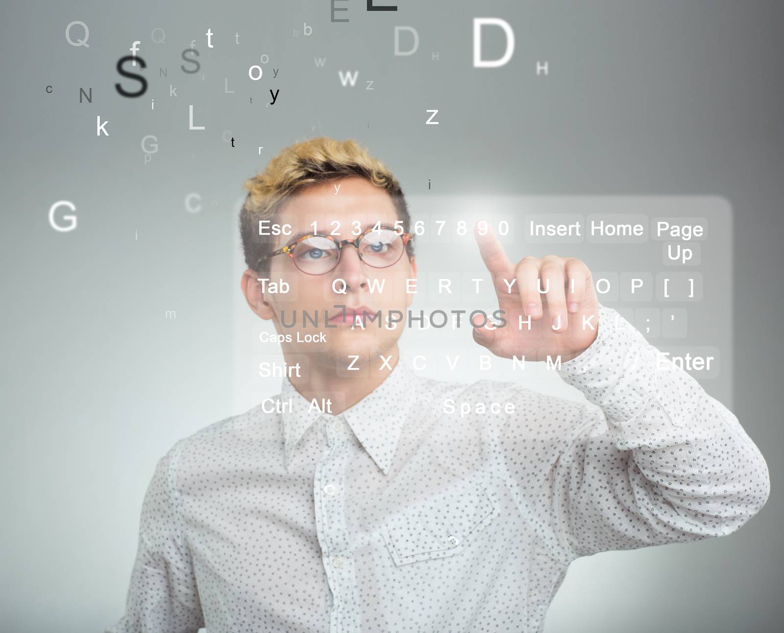 Young businessman pressing application button on computer with touch screen