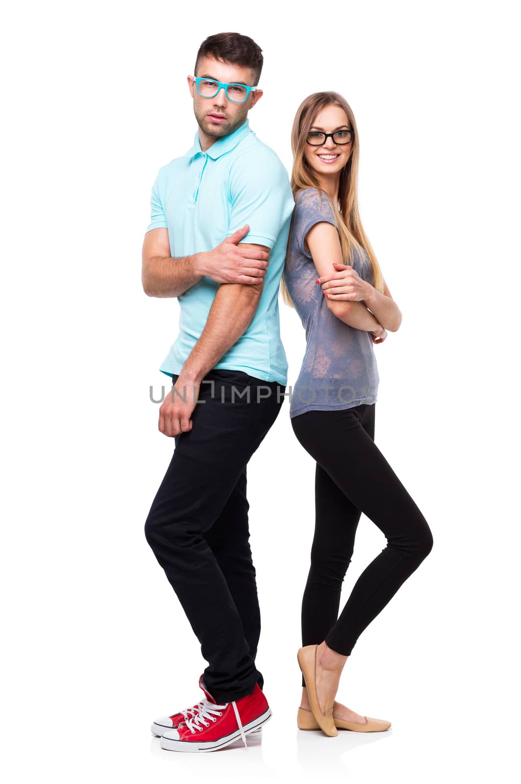 Beautiful young happy couple smiling, man and woman looking at camera, isolated over white background