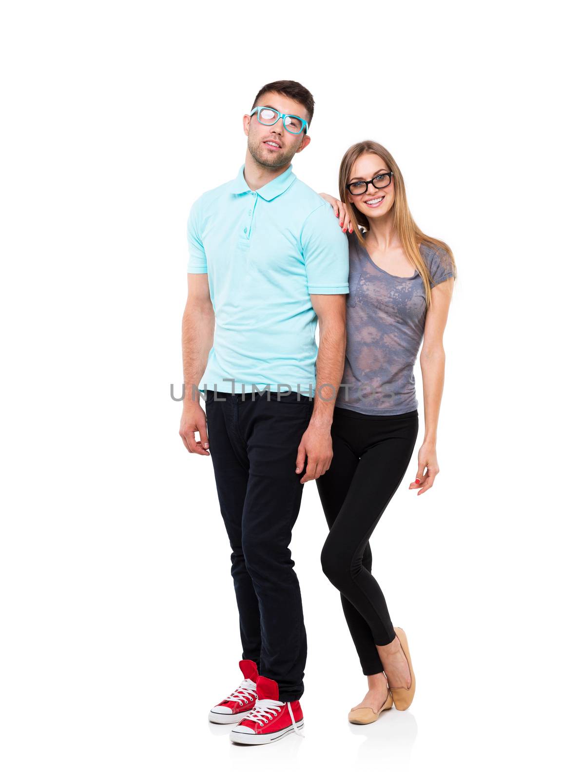 Beautiful young happy couple smiling, man and woman looking at camera, isolated over white background