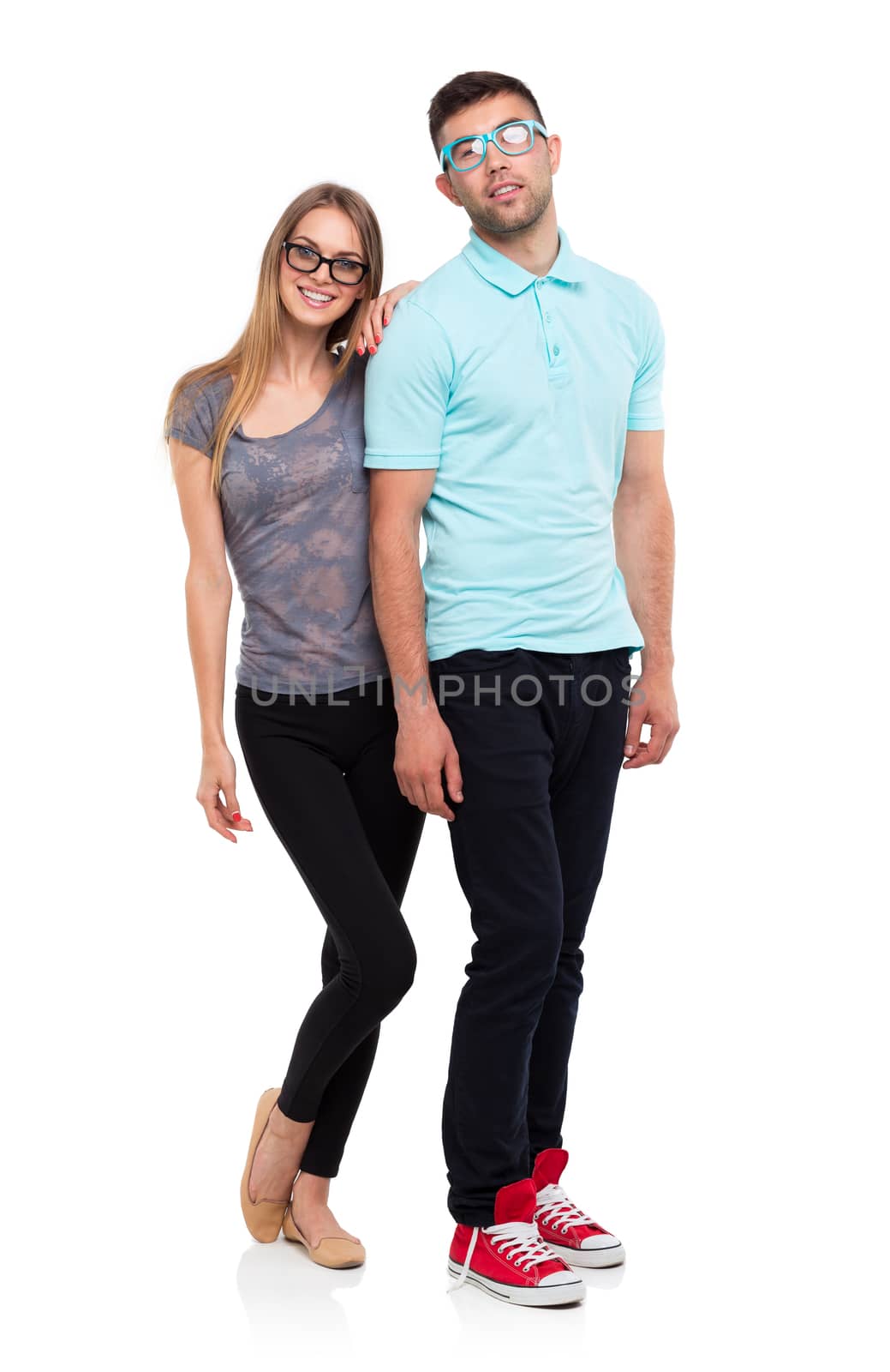 Beautiful young happy couple smiling, man and woman looking at camera, isolated over white background