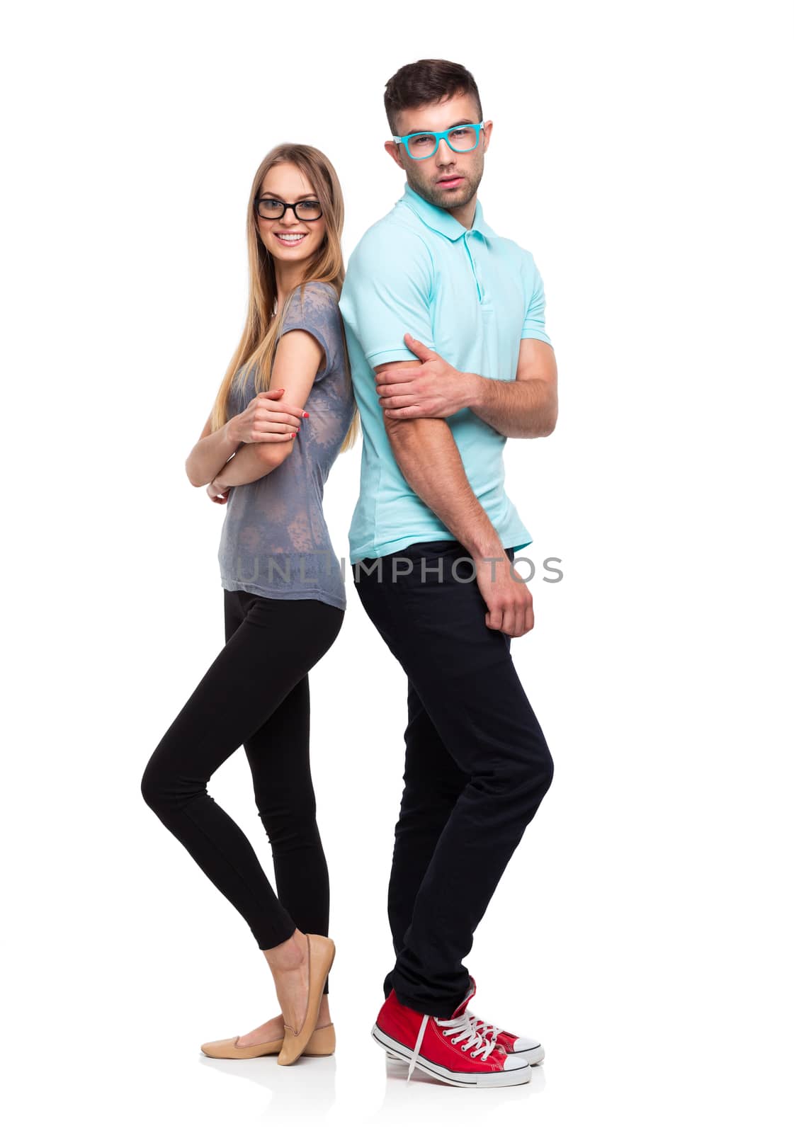Beautiful young happy couple smiling, man and woman looking at camera, isolated over white background