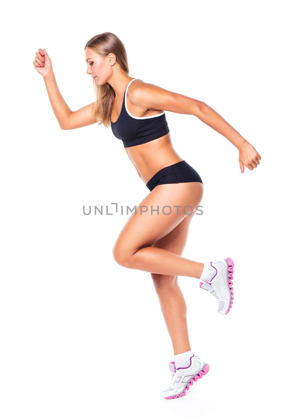 Young athletic girl on white background