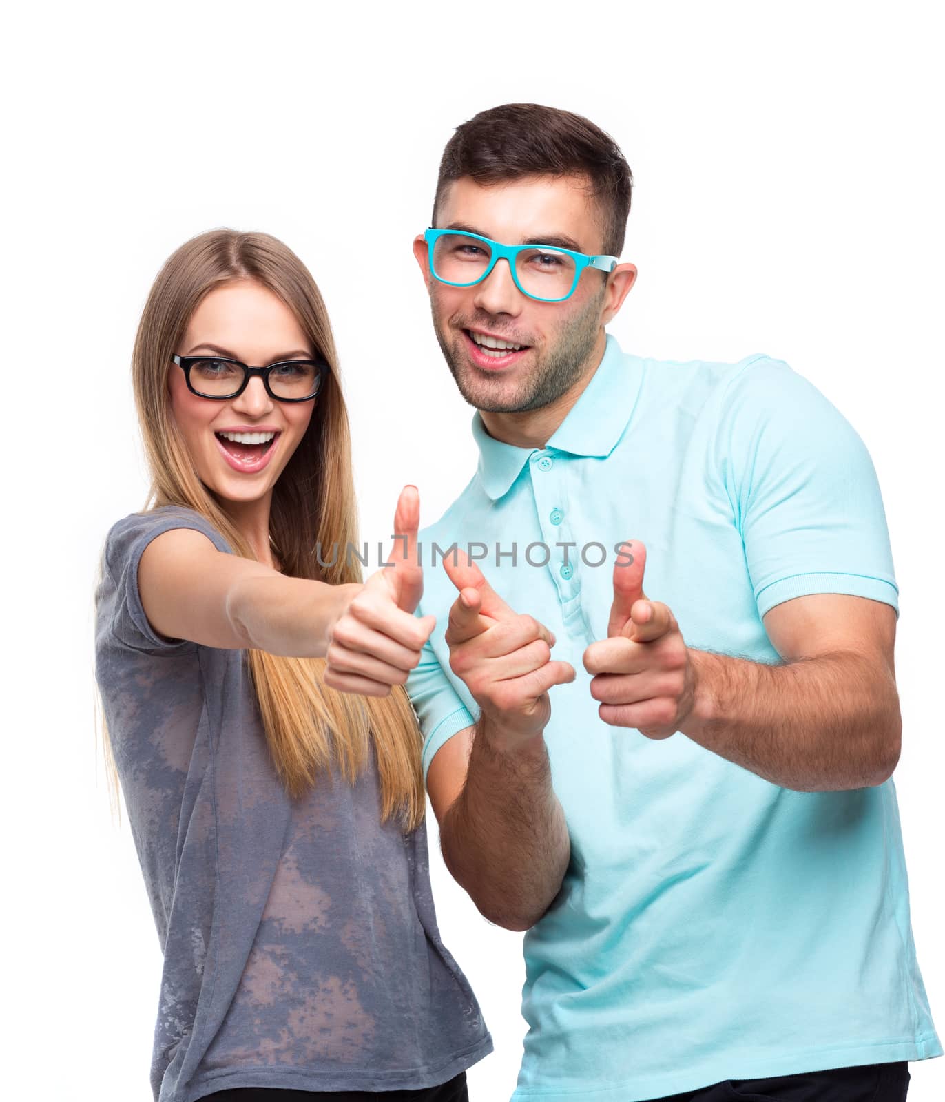 Happy couple smiling holding thumb up gesture, beautiful young man and woman smile looking at camera on white