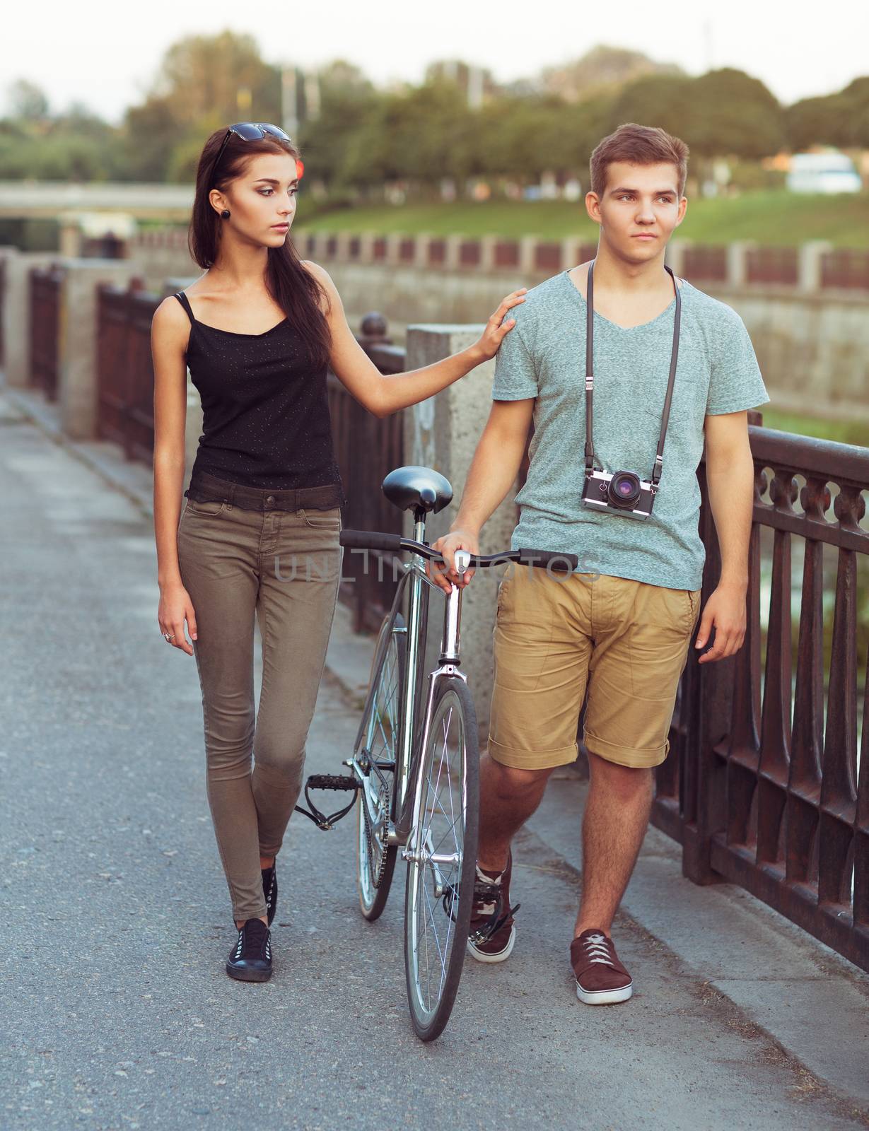 Happy couple with bike in the city by vlad_star