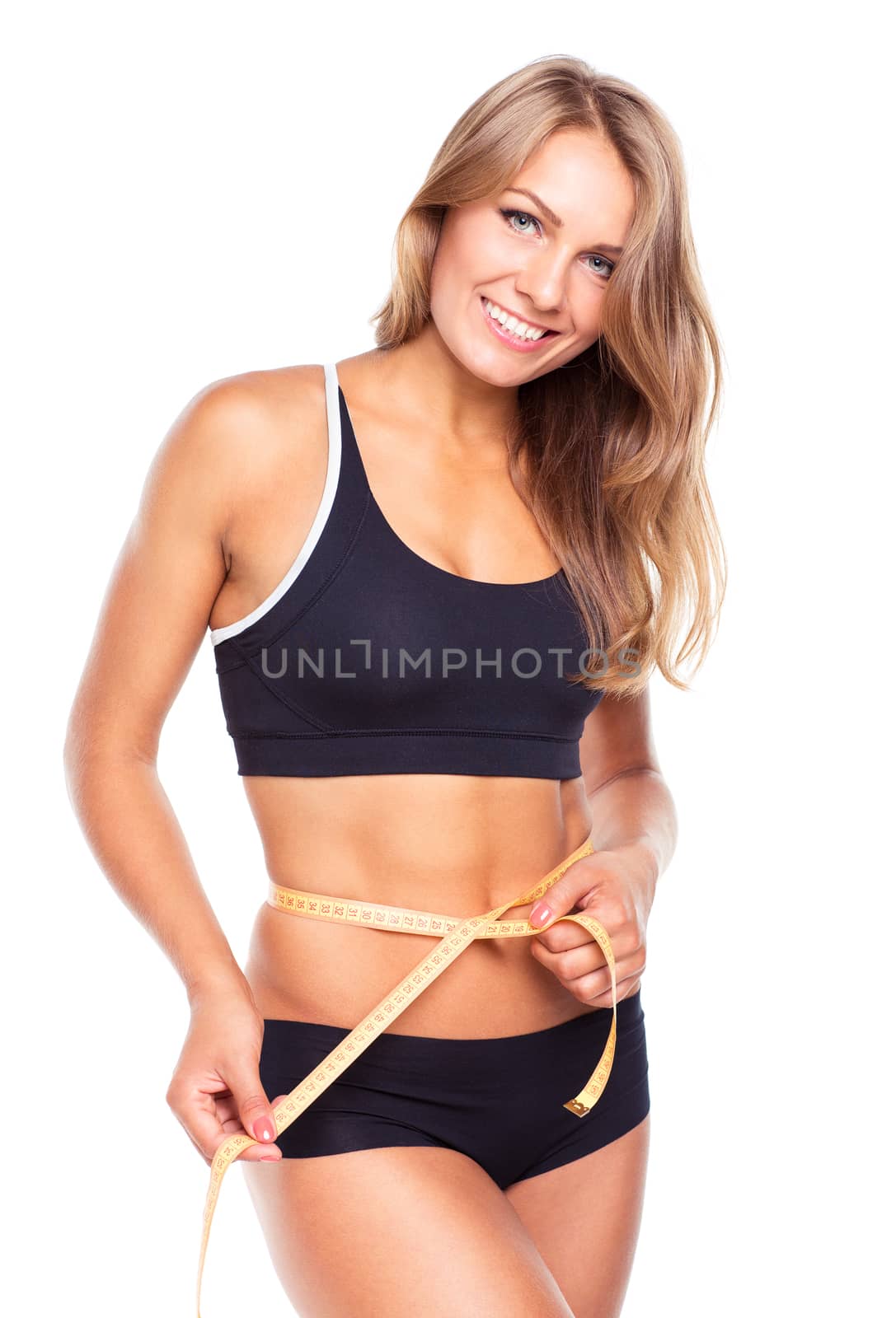 Portrait of attractive caucasian smiling woman with measuring tape isolated on white background