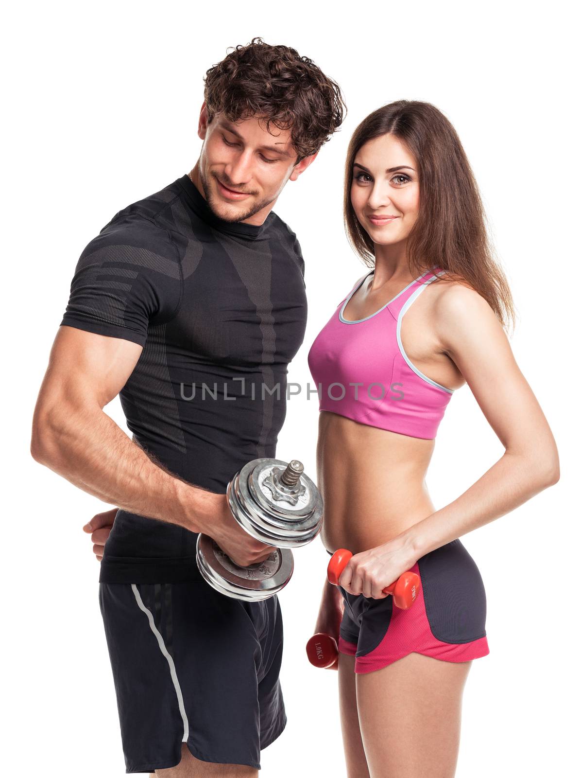 Athletic man and woman with dumbbells on the white background by vlad_star