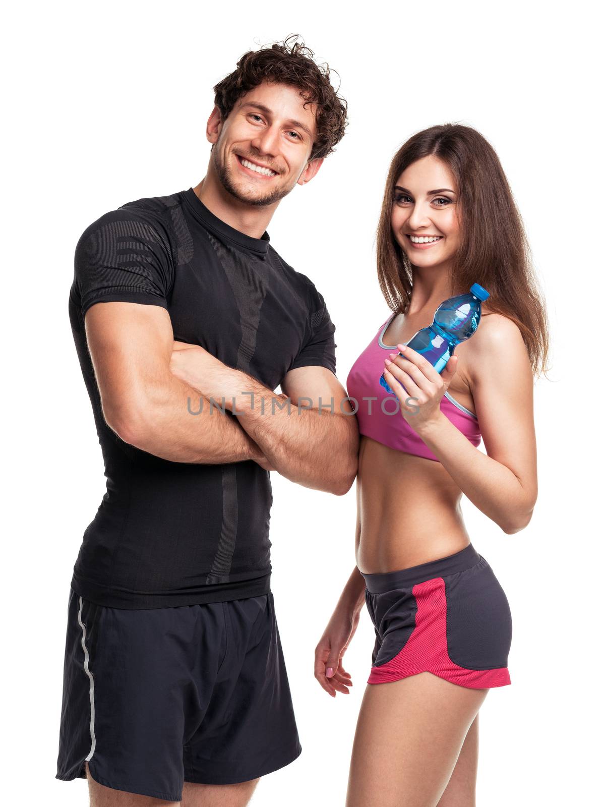 Athletic couple - man and woman with bottle of water on the white background