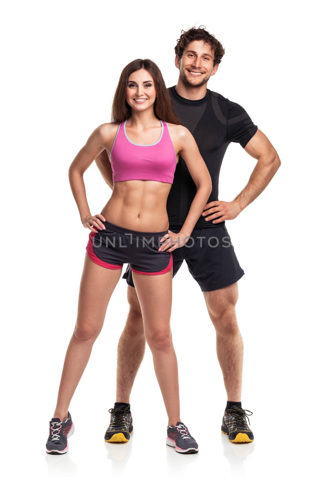 Athletic  man and woman after fitness exercise on the white back by vlad_star