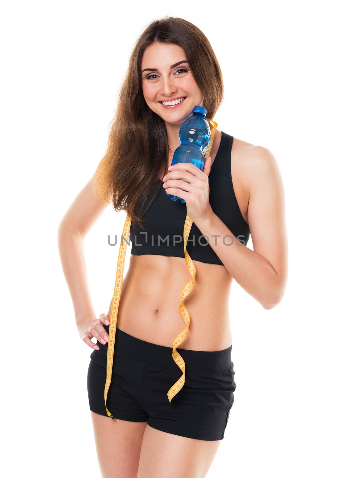 Portrait of attractive caucasian smiling woman with bottle of water isolated on white background