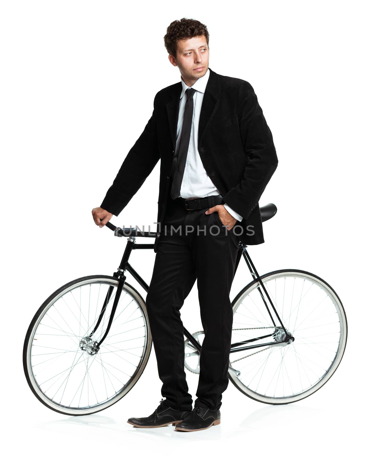 Attractive man in a classic suit with a bicycle on a white background