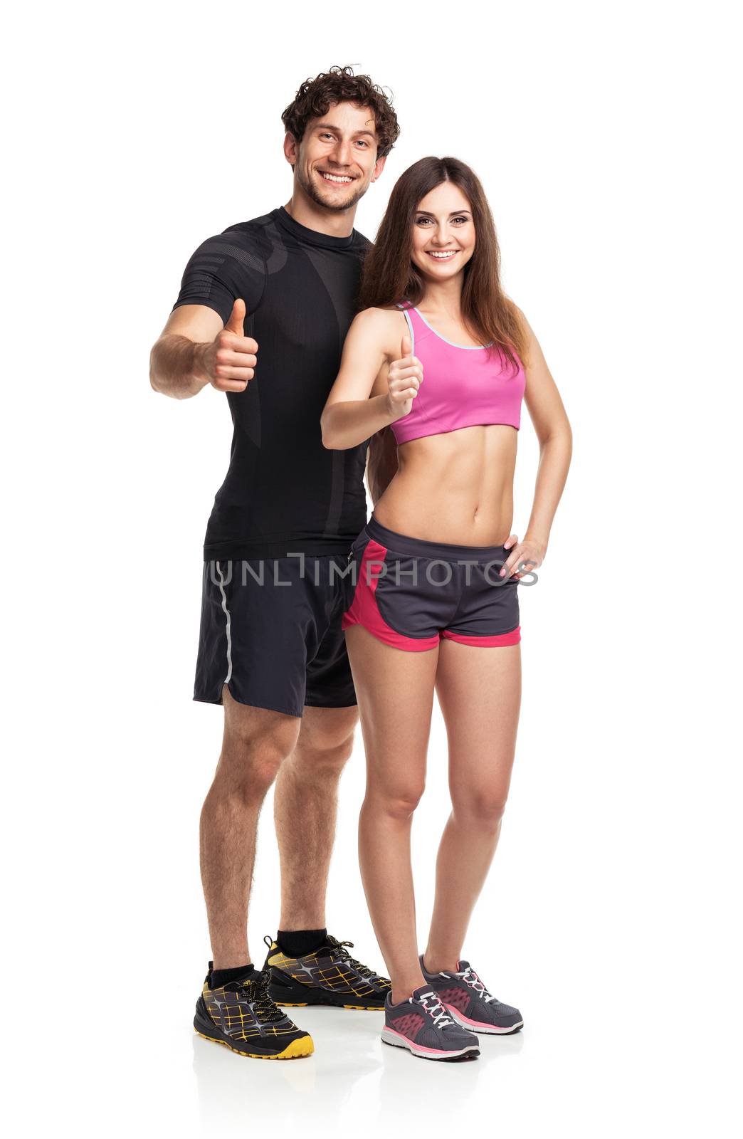 Athletic man and woman after fitness exercise on the white background