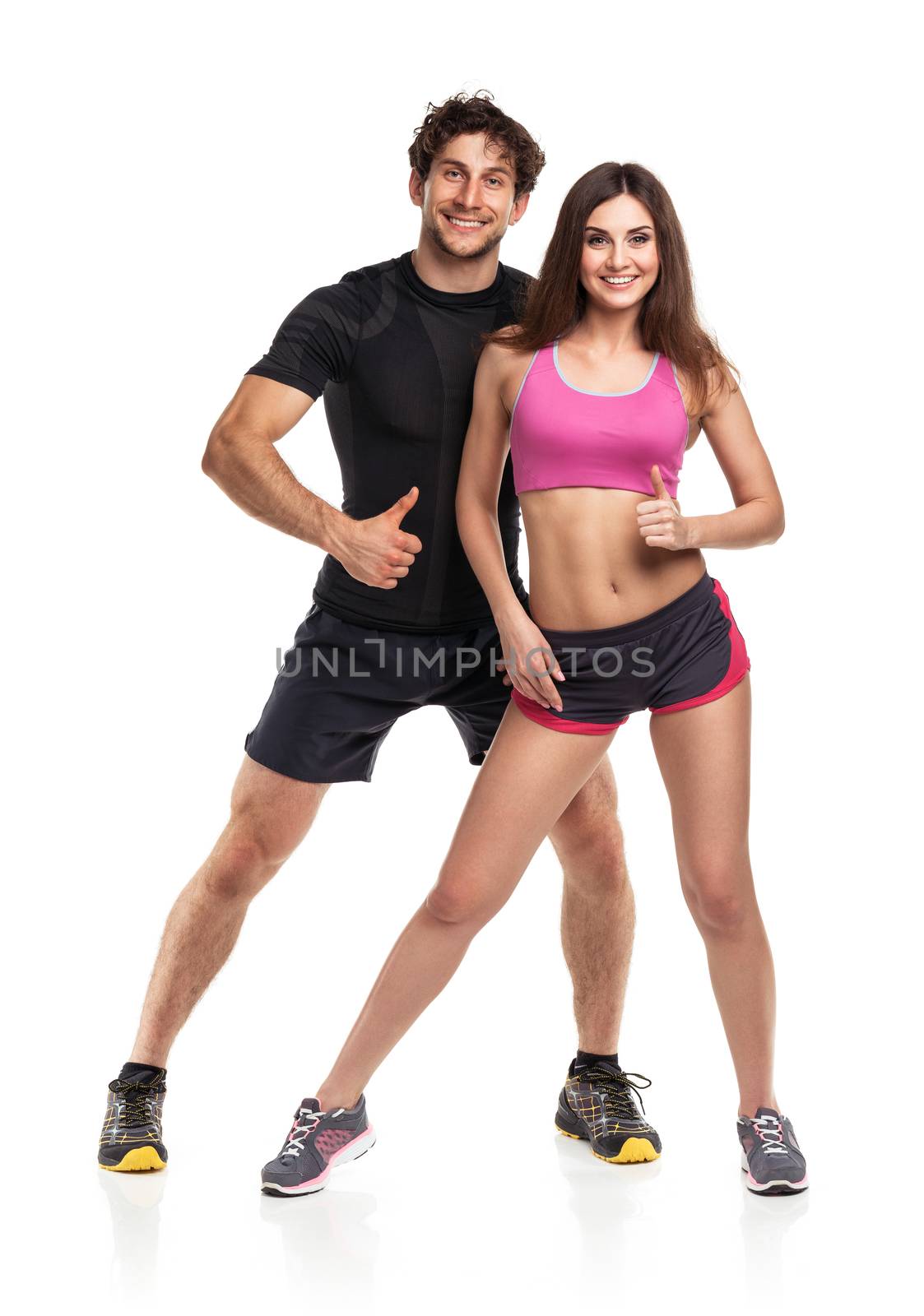 Athletic man and woman after fitness exercise on the white background