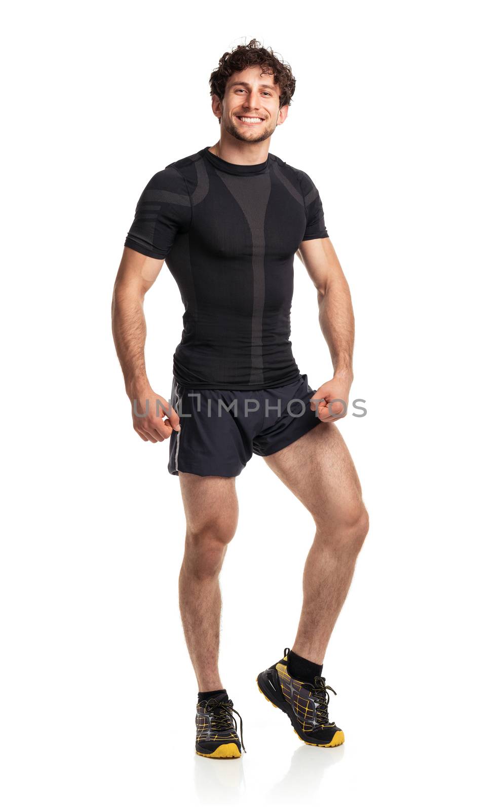 Athletic attractive man after fitness exersise on the white background