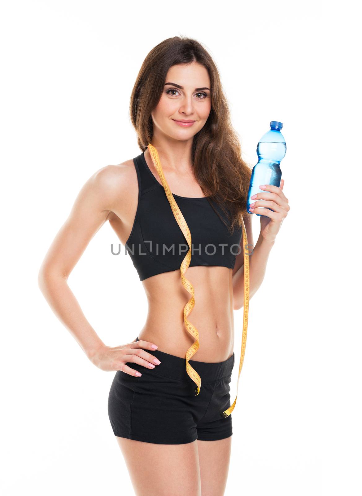 Portrait of attractive caucasian smiling woman with bottle of water isolated on white background