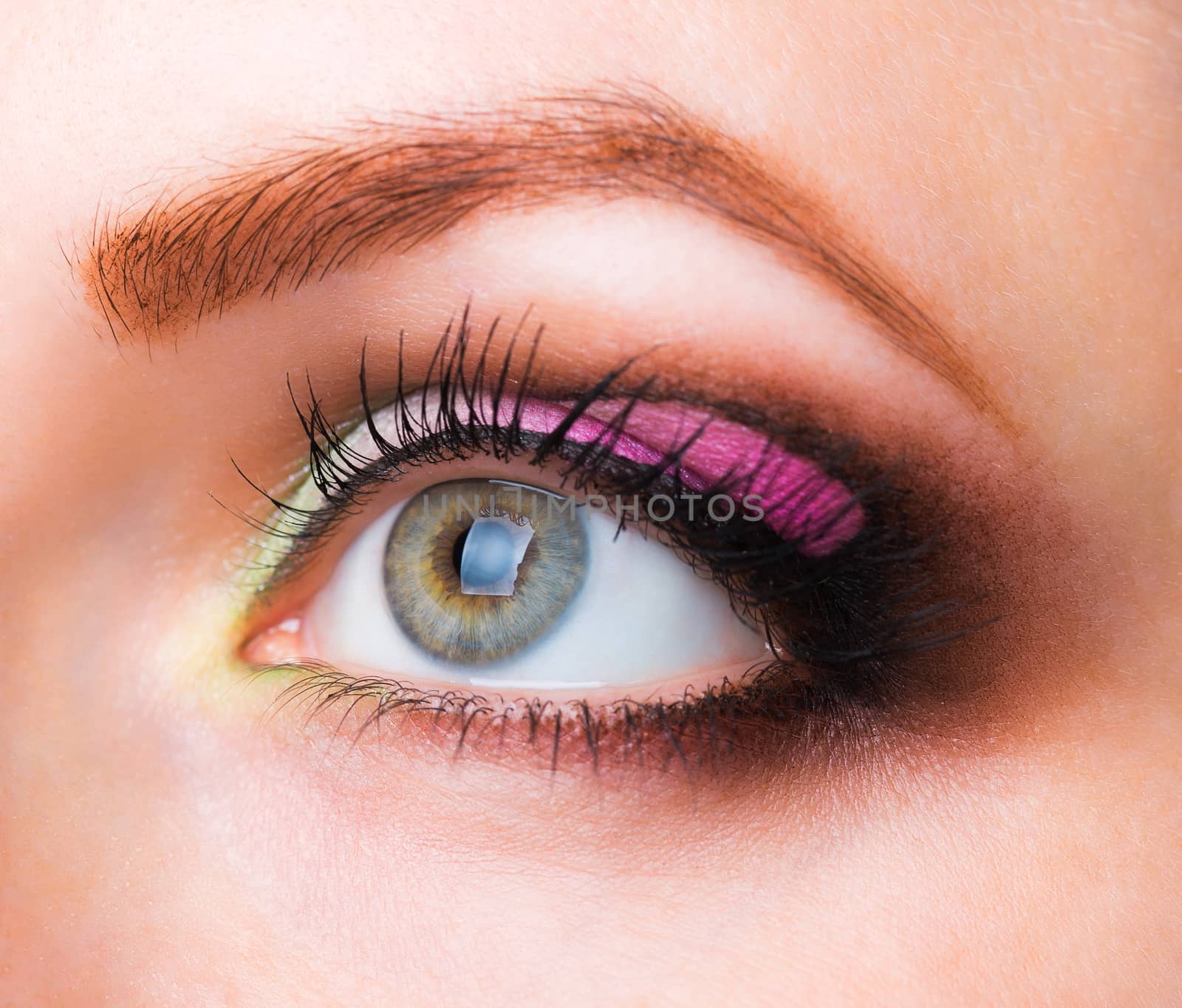 Closeup of womanish eye with glamorous makeup by vlad_star