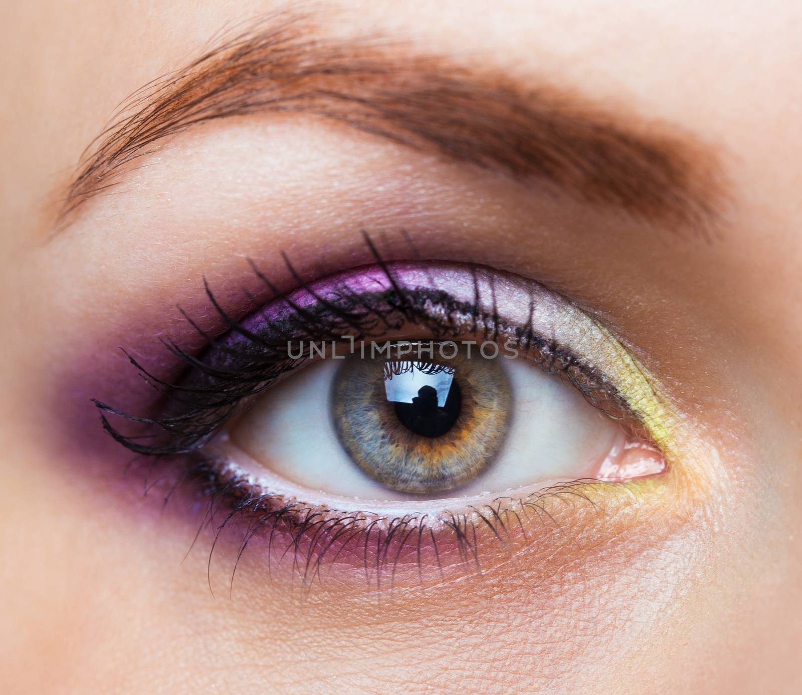 Closeup of beautiful womanish eye with glamorous makeup