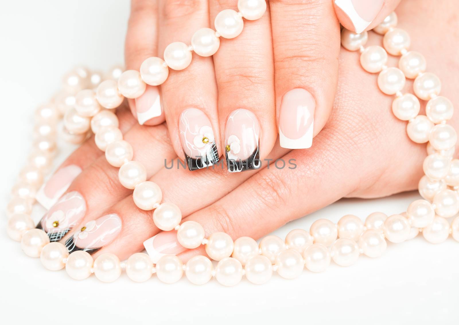 Female hands with manicure closeup on light background