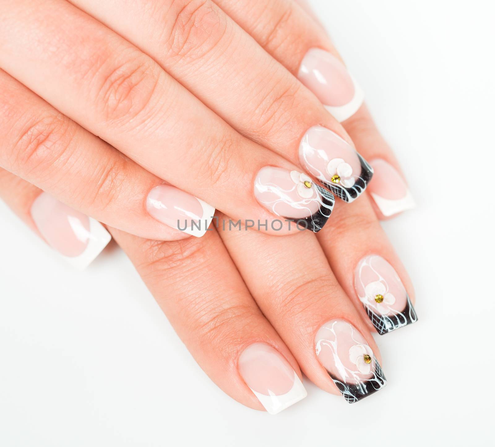 Beautiful female hands with manicure on a light background