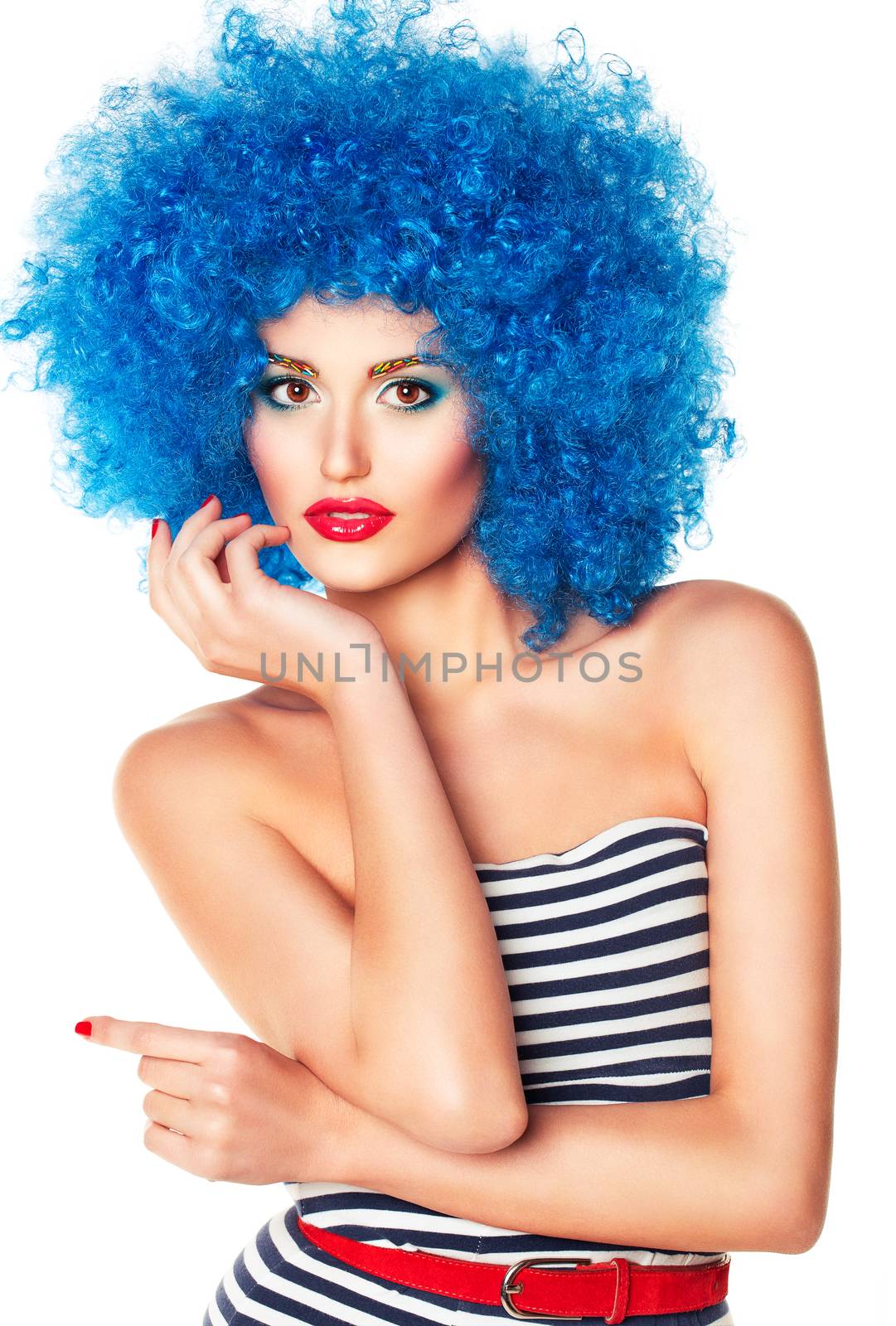 Portrait of a young beautiful girl with bright makeup, red lips in blue wig