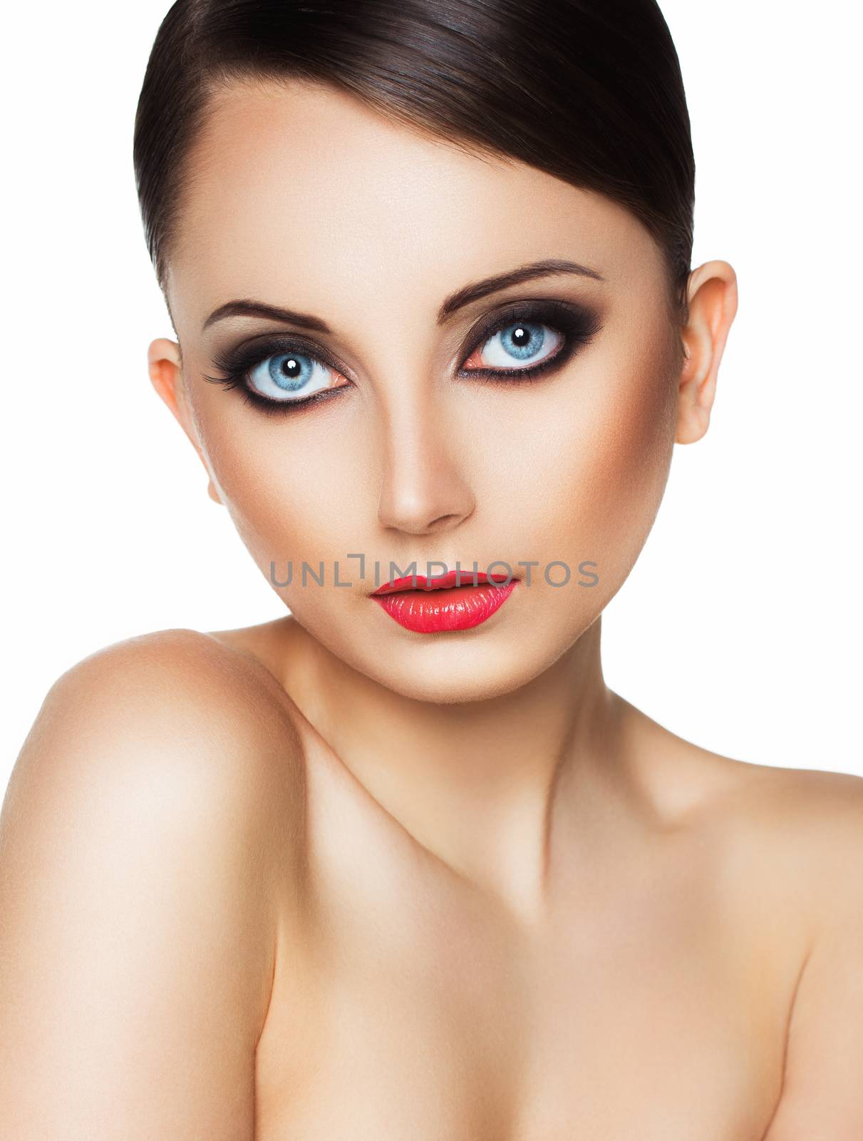 Closeup portrait of a beautiful young woman with a glamorous retro makeup