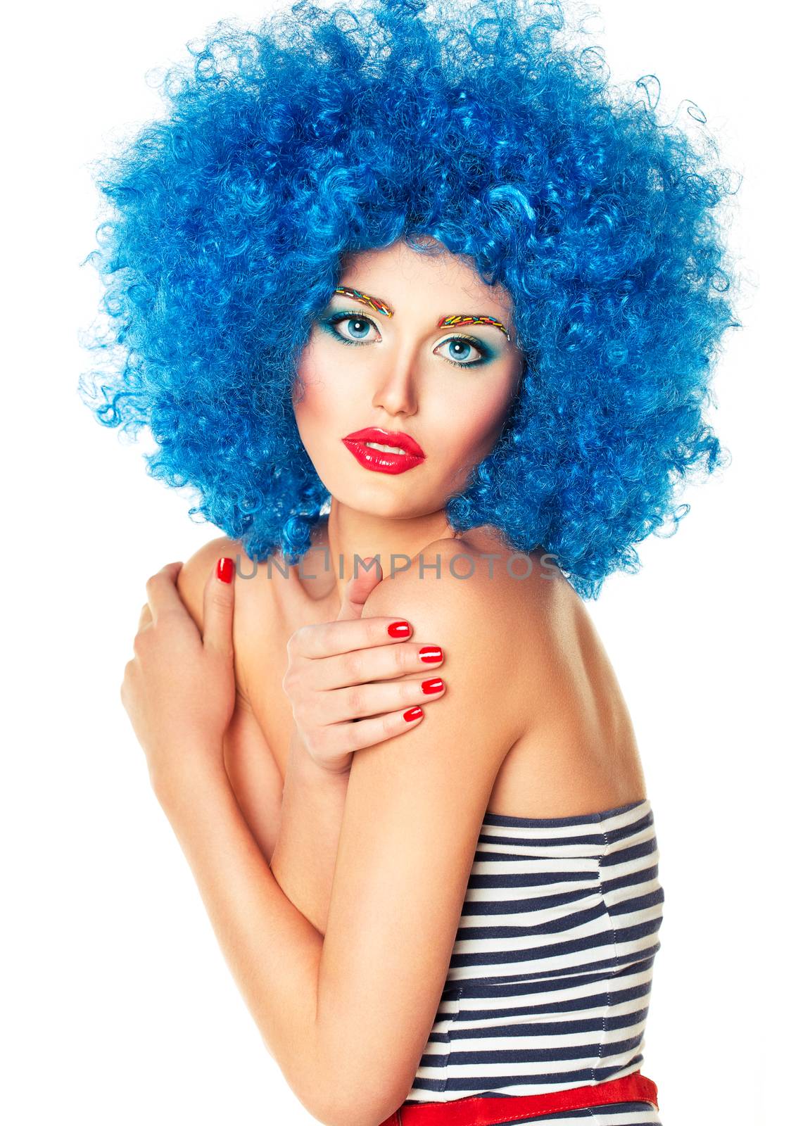 Portrait of a young beautiful girl with bright makeup, red lips in blue wig