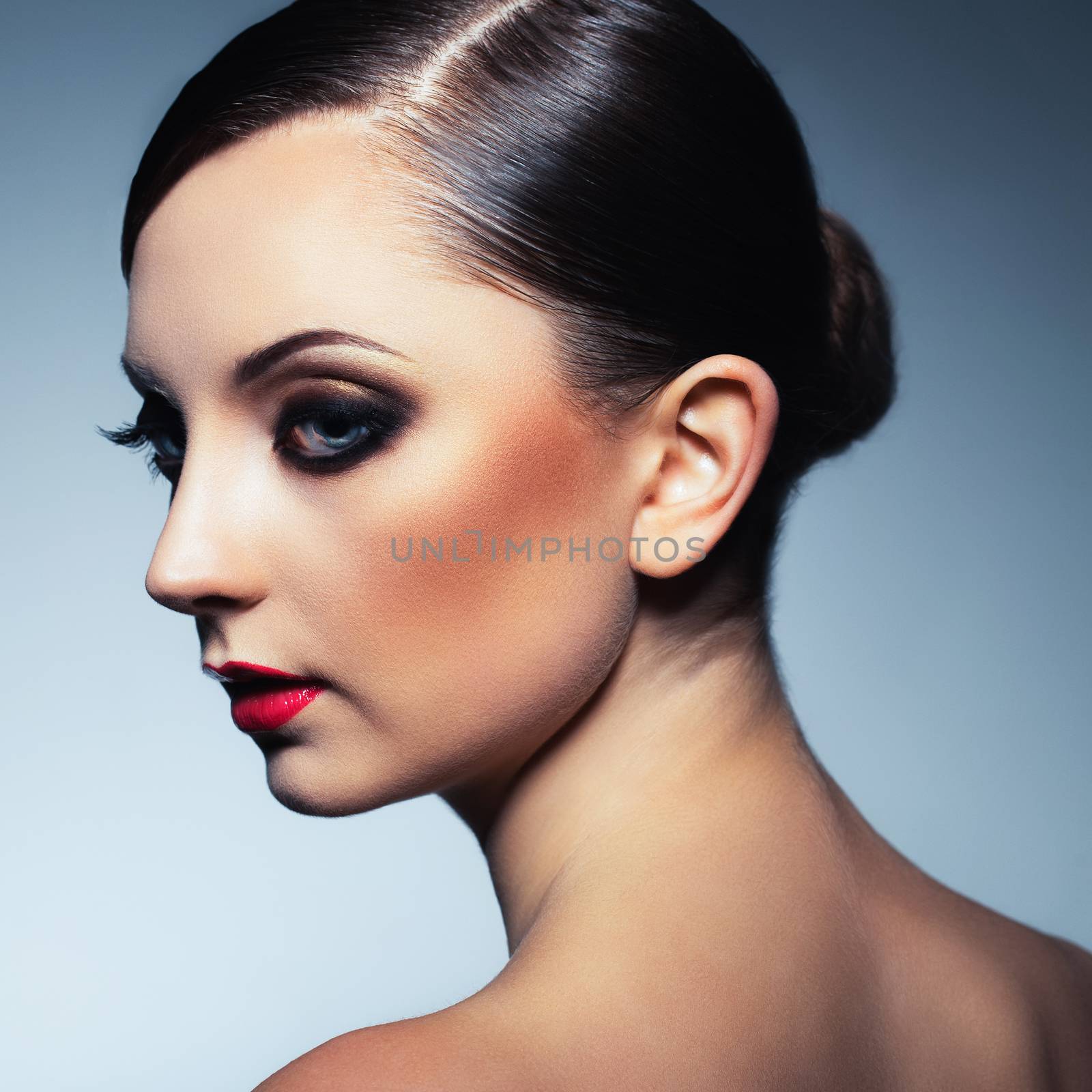 Portrait of a beautiful woman with a glamorous retro makeup by vlad_star