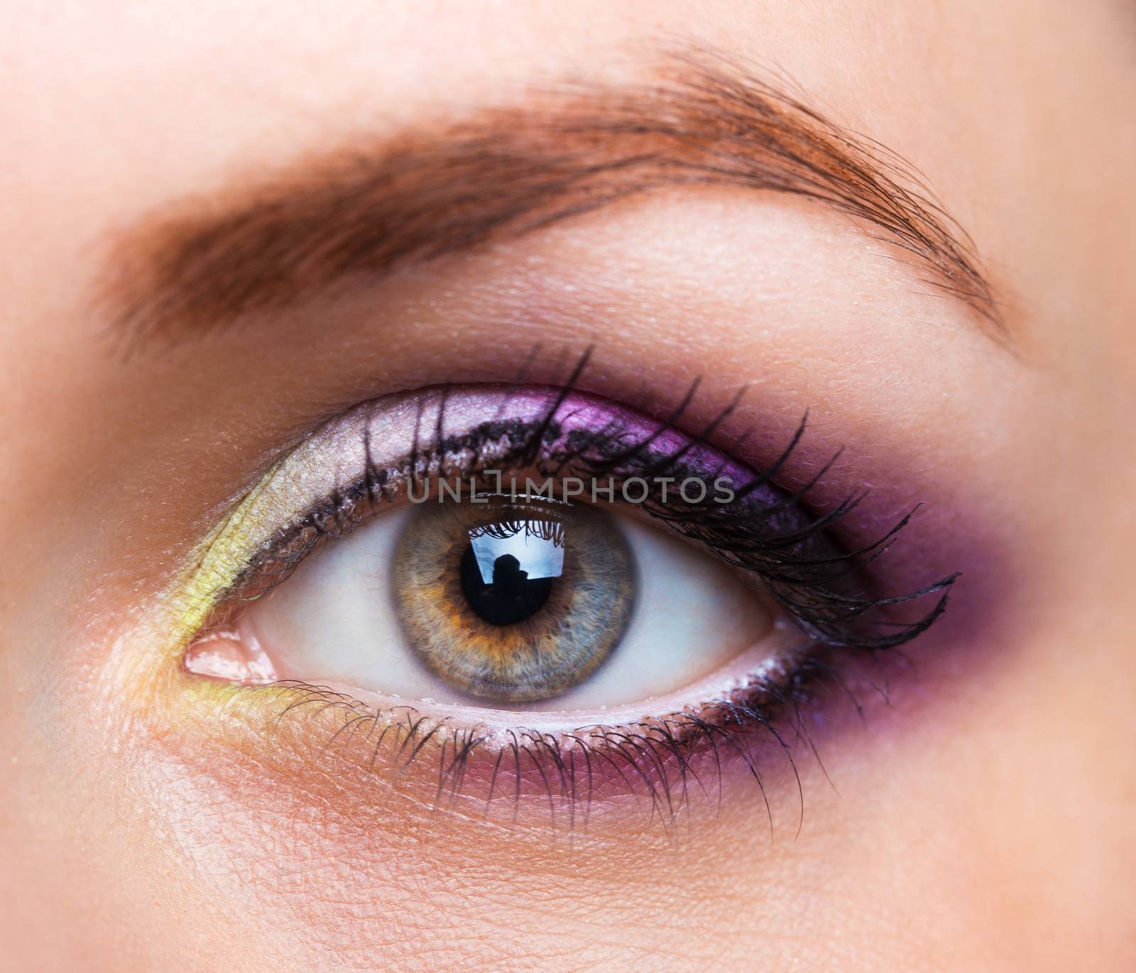 Closeup of beautiful womanish eye with glamorous makeup