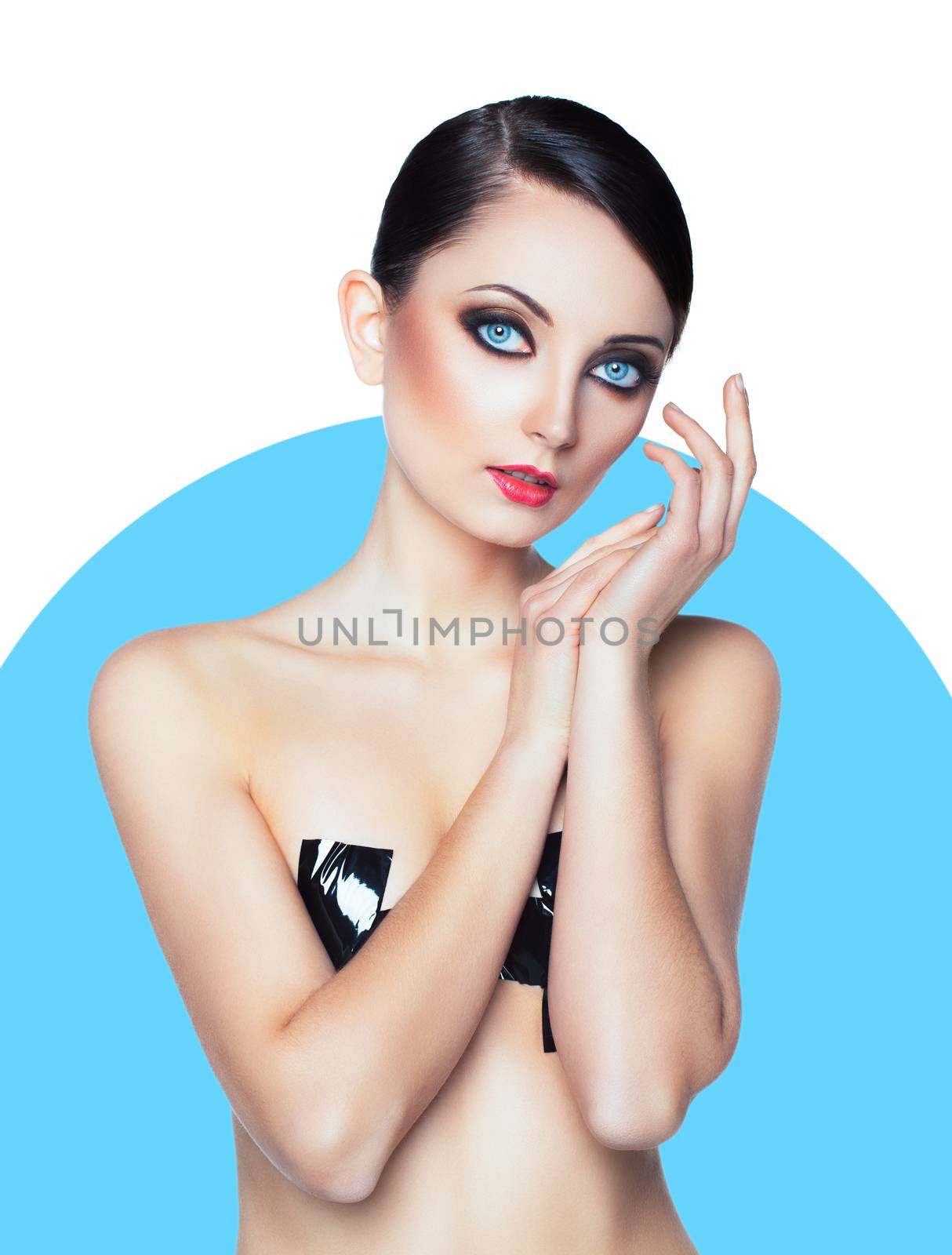 Portrait of a beautiful young woman with a glamorous retro makeup