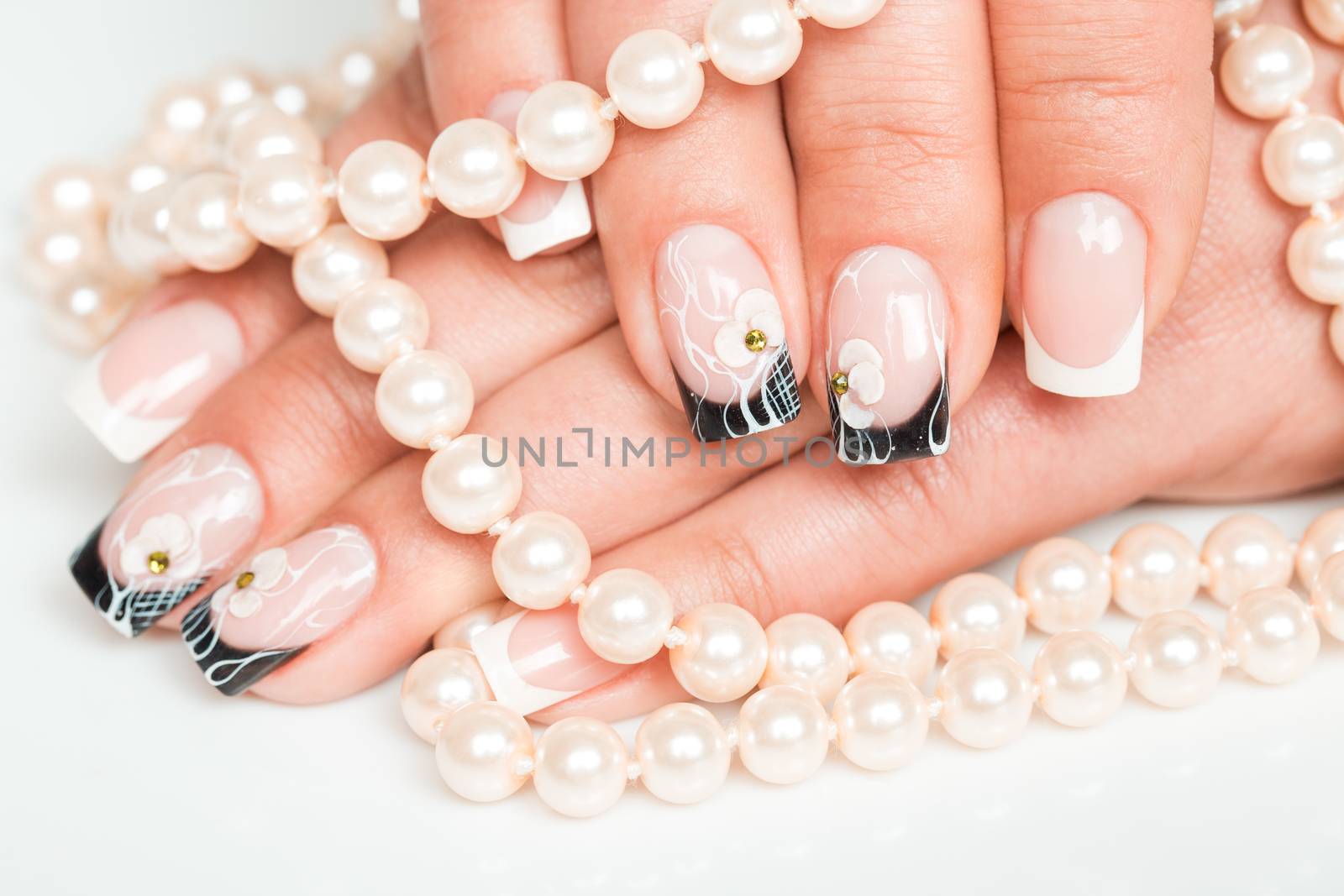 Female hands with manicure closeup on light background