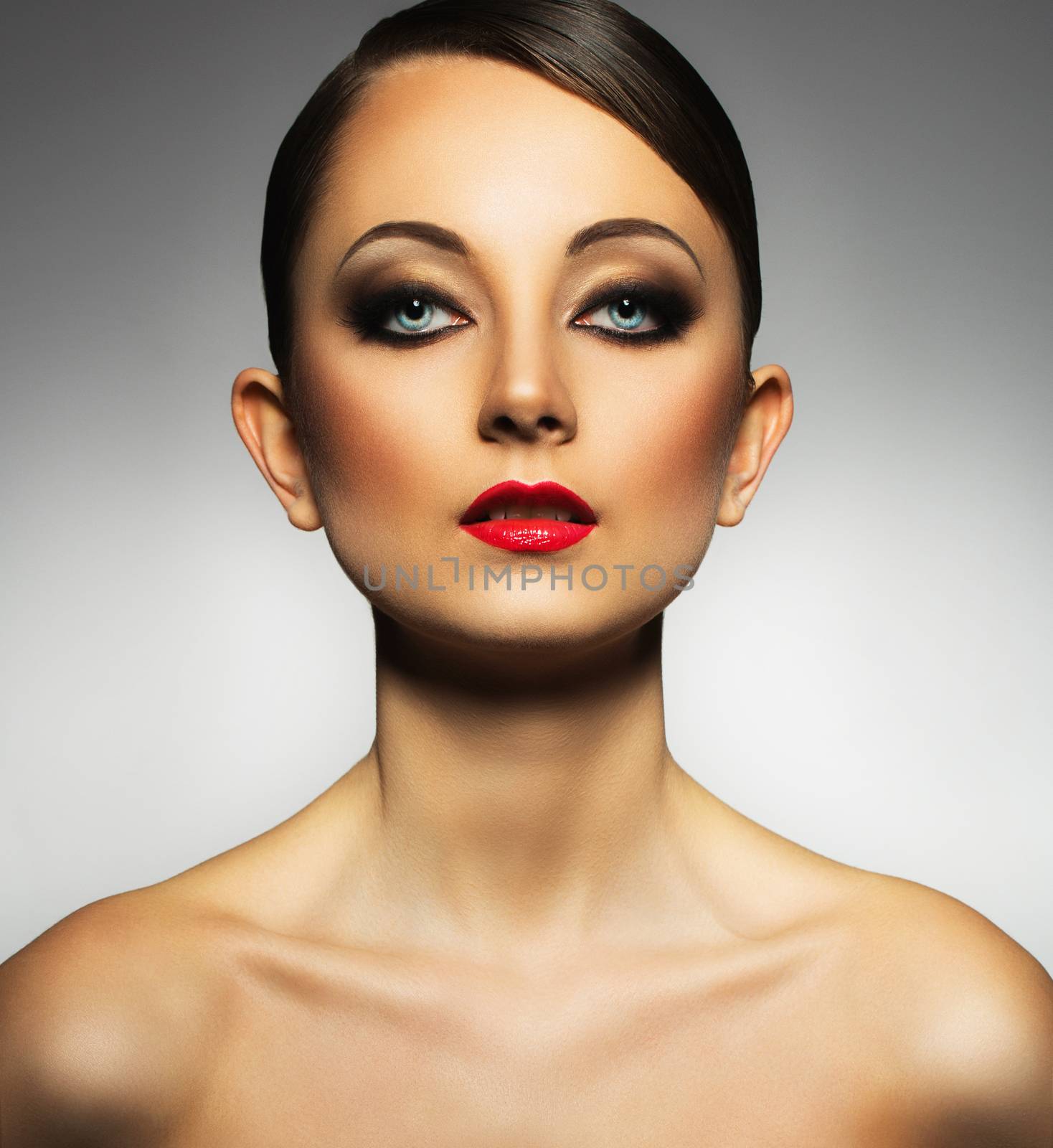 Portrait of a beautiful young woman with a glamorous retro makeup