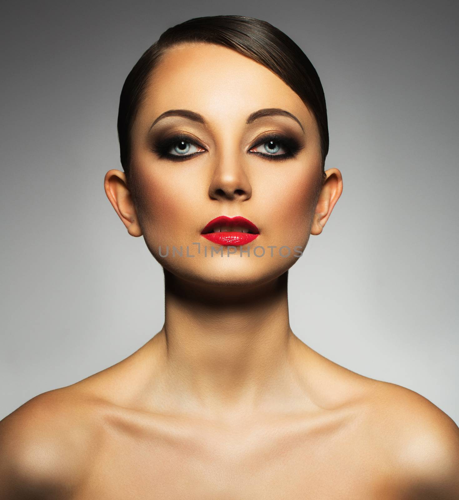 Portrait of a beautiful woman with a glamorous retro makeup by vlad_star