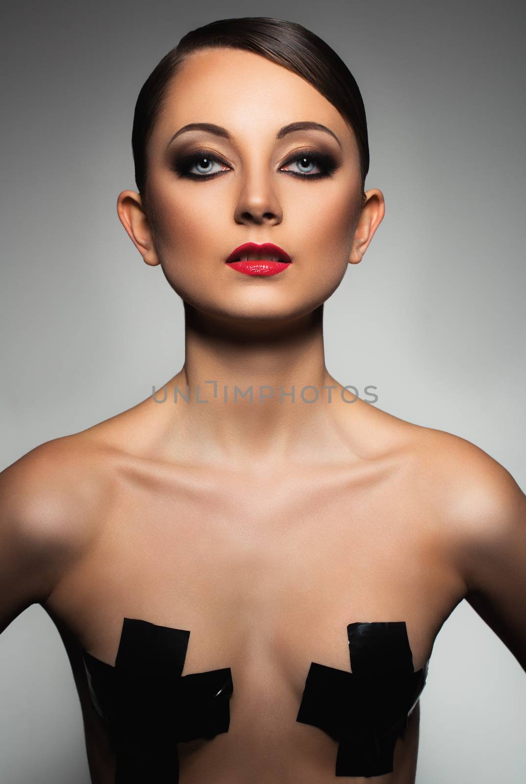 Portrait of a beautiful woman with a glamorous retro makeup by vlad_star