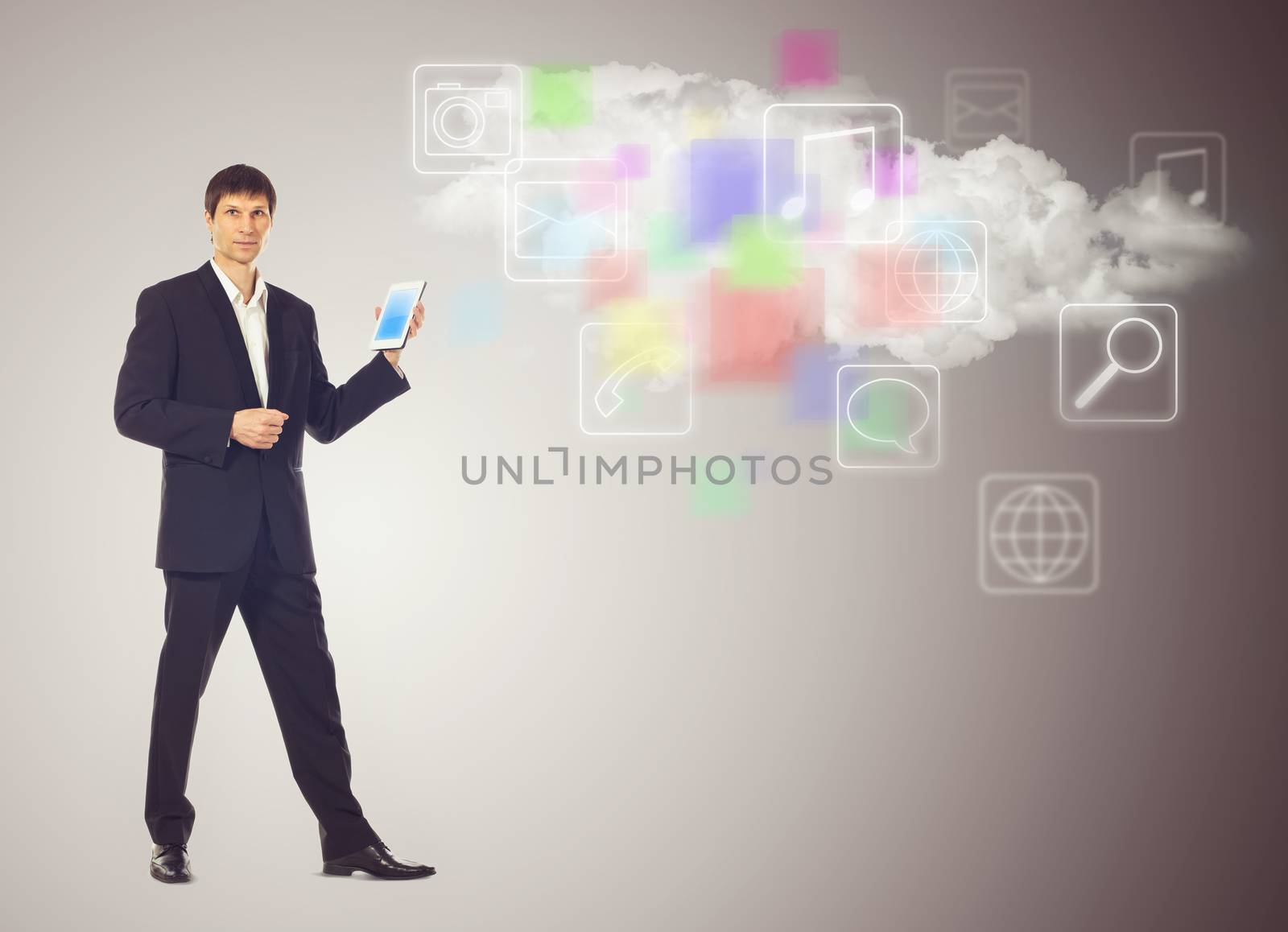 Businessman with tablet and the cloud with applications icons by vlad_star