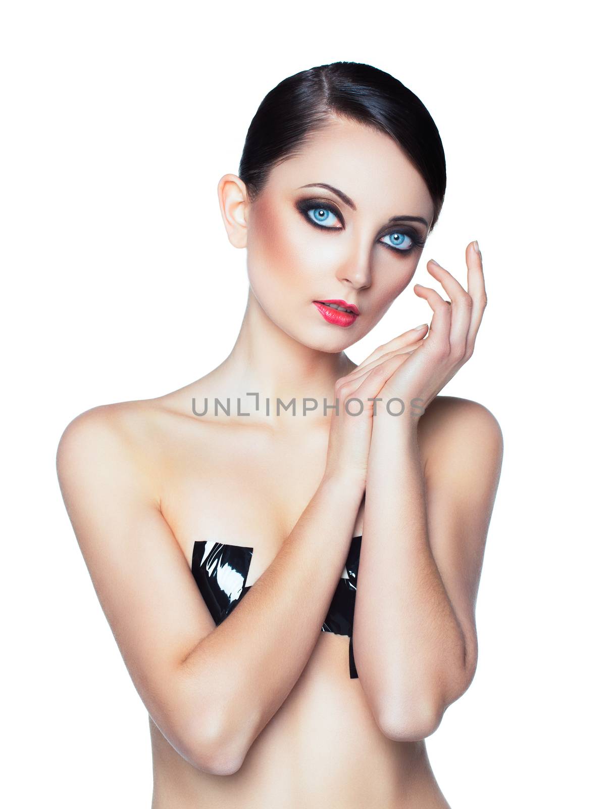 Portrait of a beautiful young woman with a glamorous retro makeup