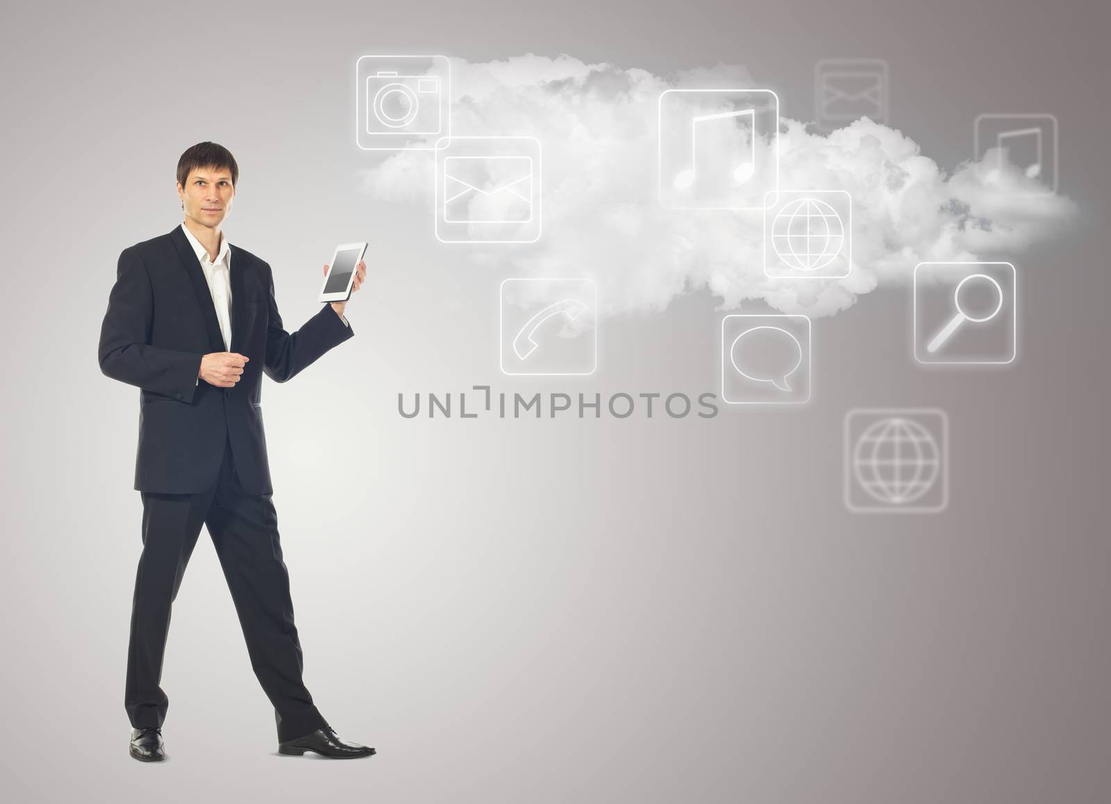 Businessman with tablet and the cloud with applications icons on by vlad_star