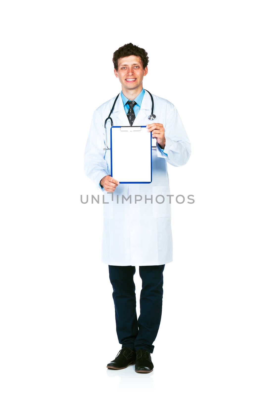 Full length young smiling male doctor showing clipboard with copy space for text on white background