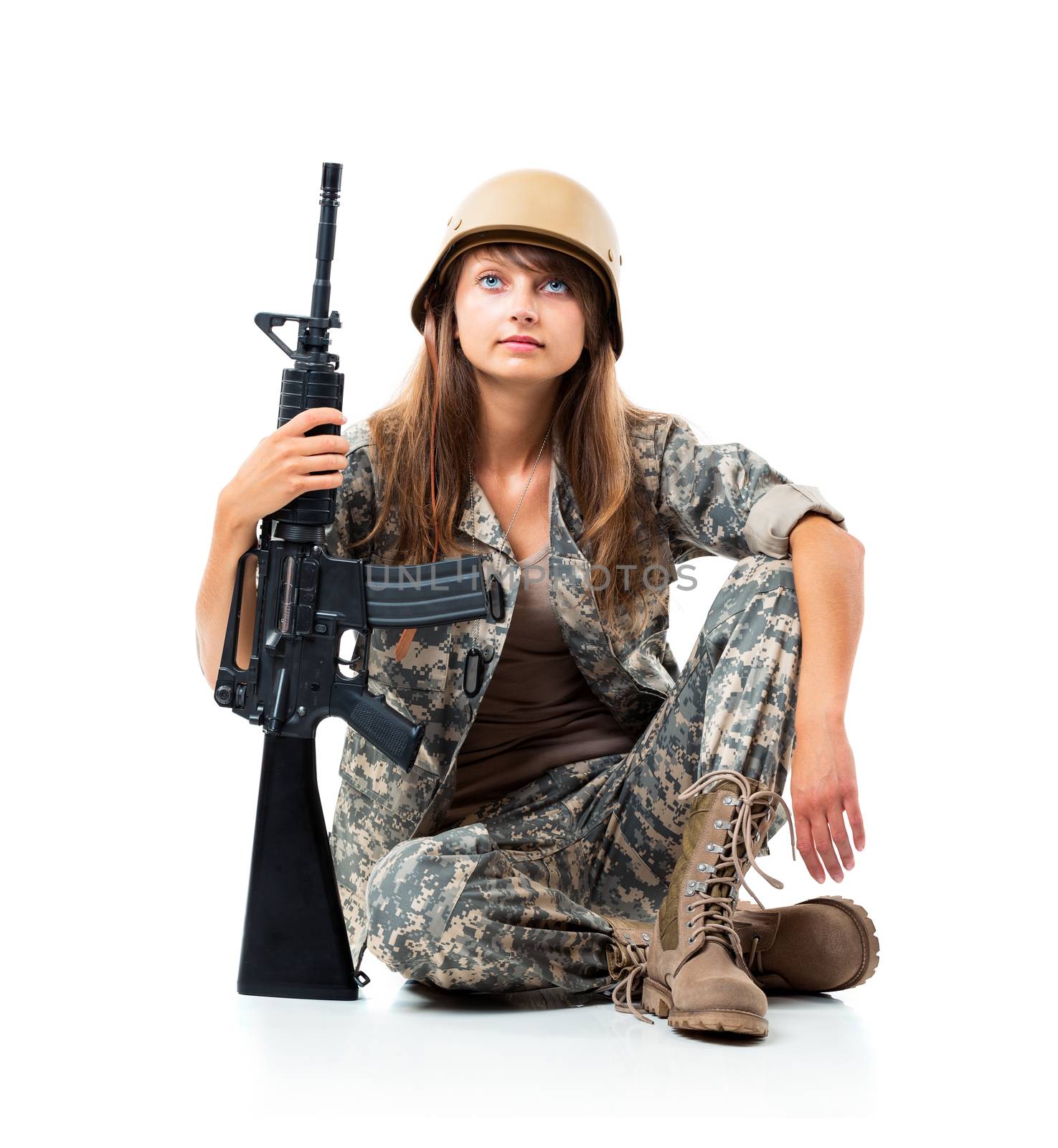 Soldier young beautyful girl dressed in a camouflage with a gun in his hand on white background