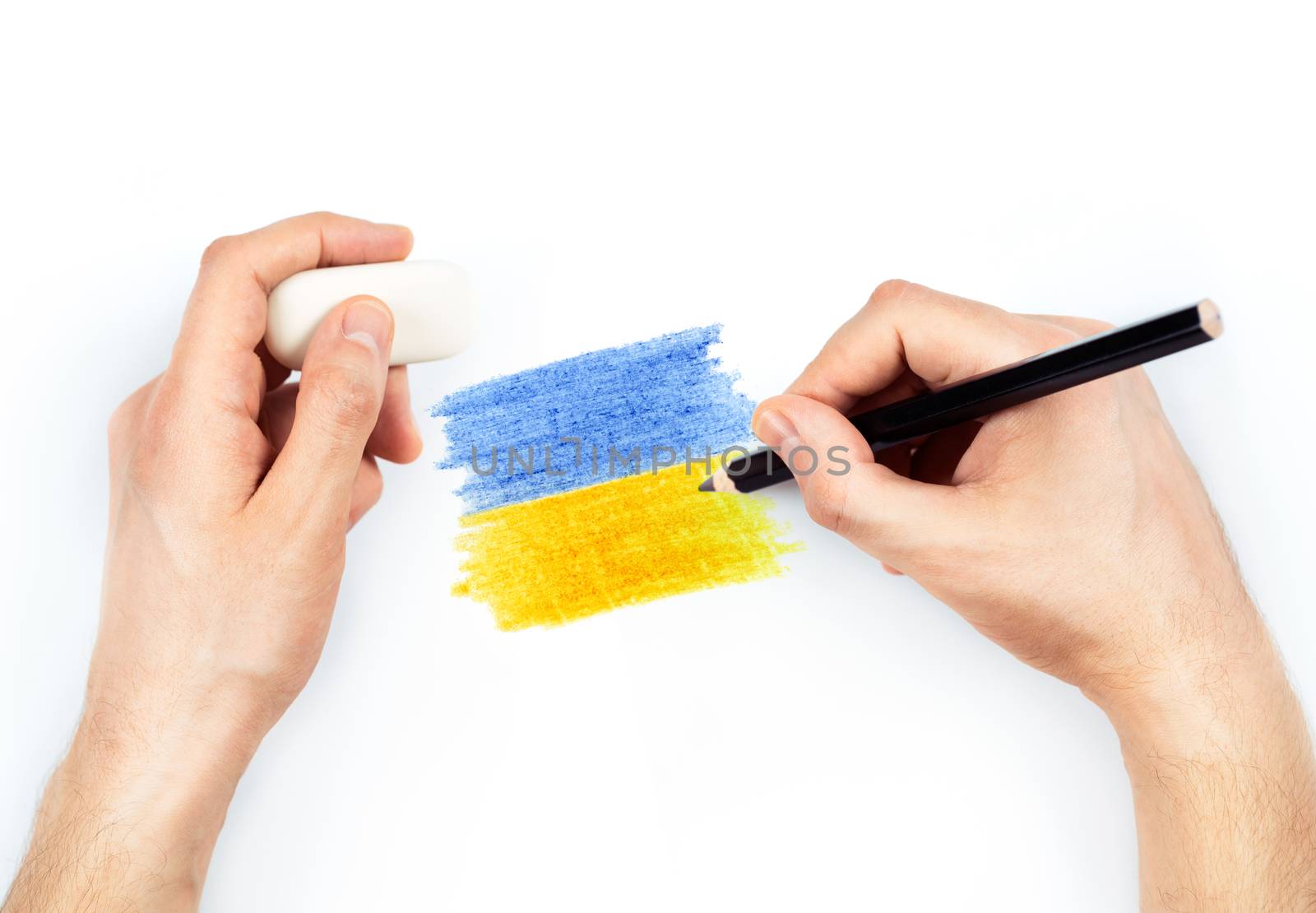 Man's hands with pencil draws flag of Ukraine on white background