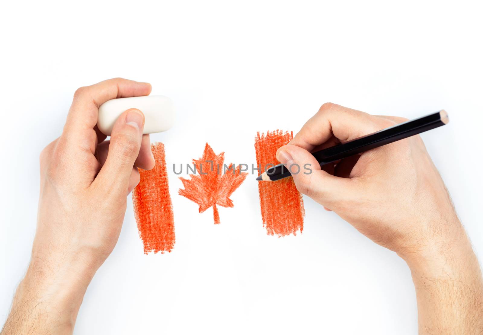 Man's hands with pencil draws flag of Canada on white by vlad_star