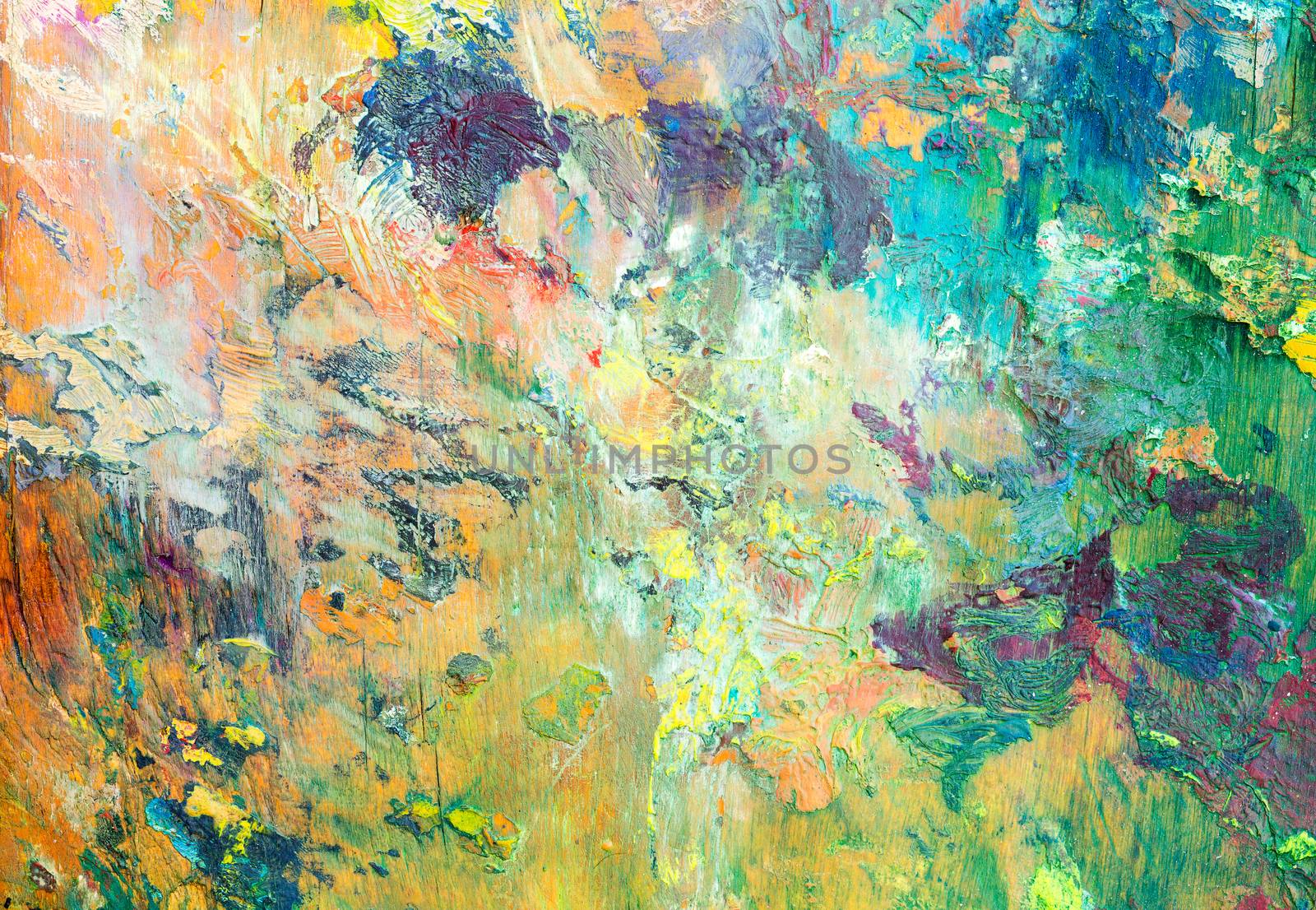 Colorful background made oil paints on a wooden background